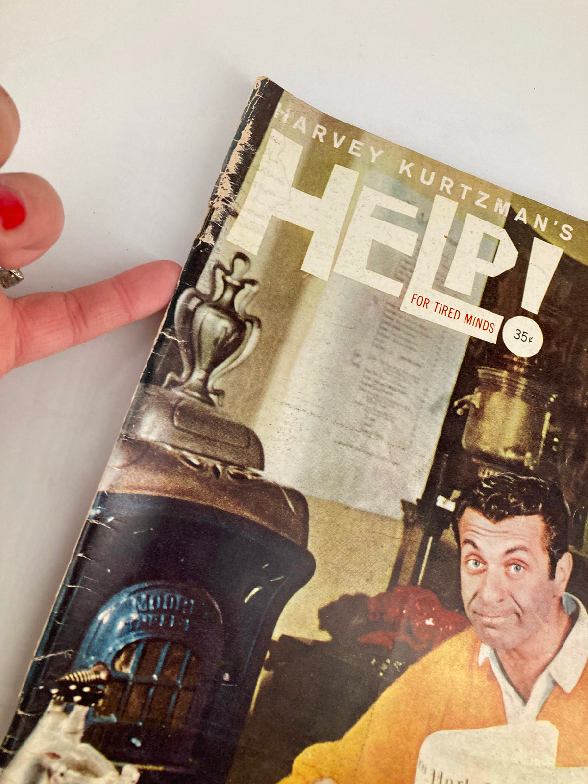 Close-up view of the VTG Help Magazine November 1960 cover highlighting the title and a vintage kettle alongside the main image. The magazine presents a nostalgic glimpse into the era's humor and political commentary.
