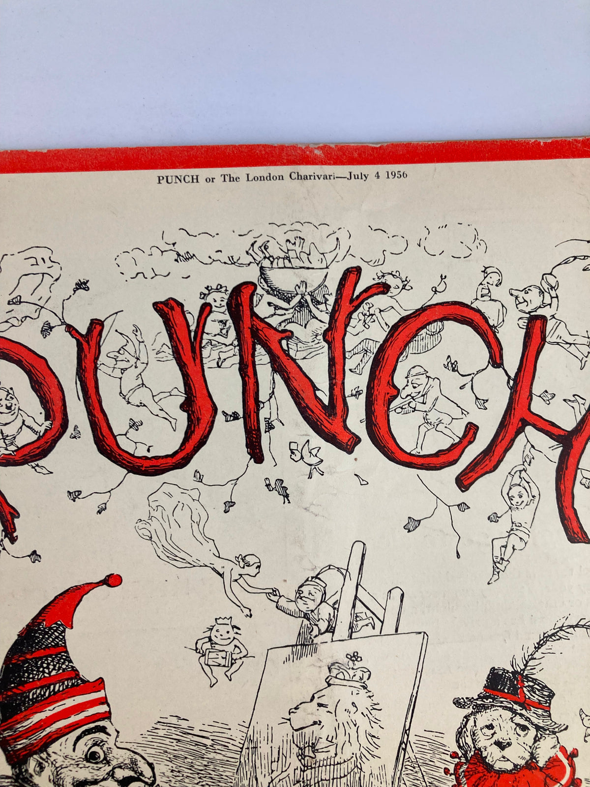 Close-up view of the VTG Punch Magazine July 4 1956 cover highlighting the bold title 'PUNCH' amidst playful characters and scenes from British satire.