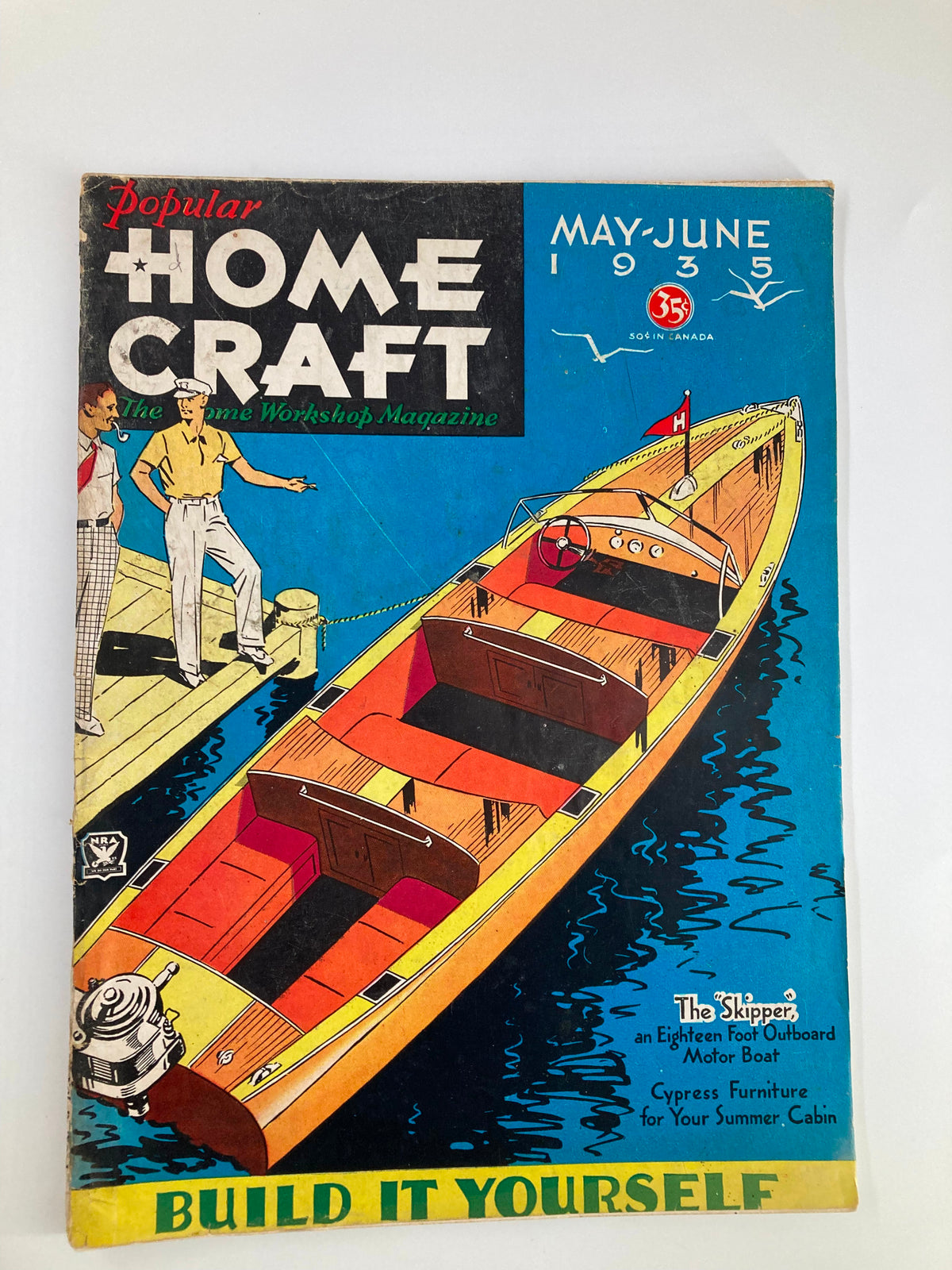 Cover of the Popular Homecraft Magazine from May 1935 featuring 'The Skipper' motor boat, with colorful illustrations and promotional text about DIY furniture and boating culture.