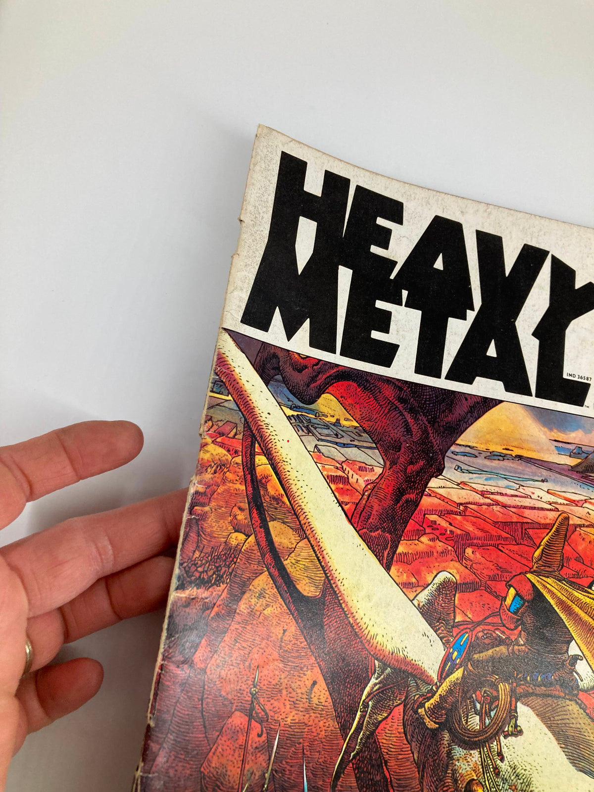 Cover of VTG Heavy Metal Magazine July 1977 showcasing vibrant artwork and bold title, indicative of the 'Crossroads of the Universe' theme.