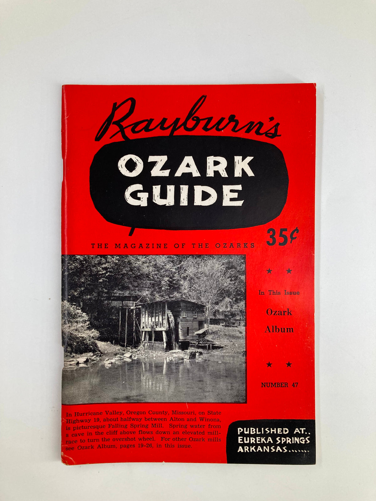 Cover of Rayburn's Ozark Guide Magazine Winter 1957 featuring a scenic black and white image of Falling Spring Mill in Hurricane Valley, Oregon.