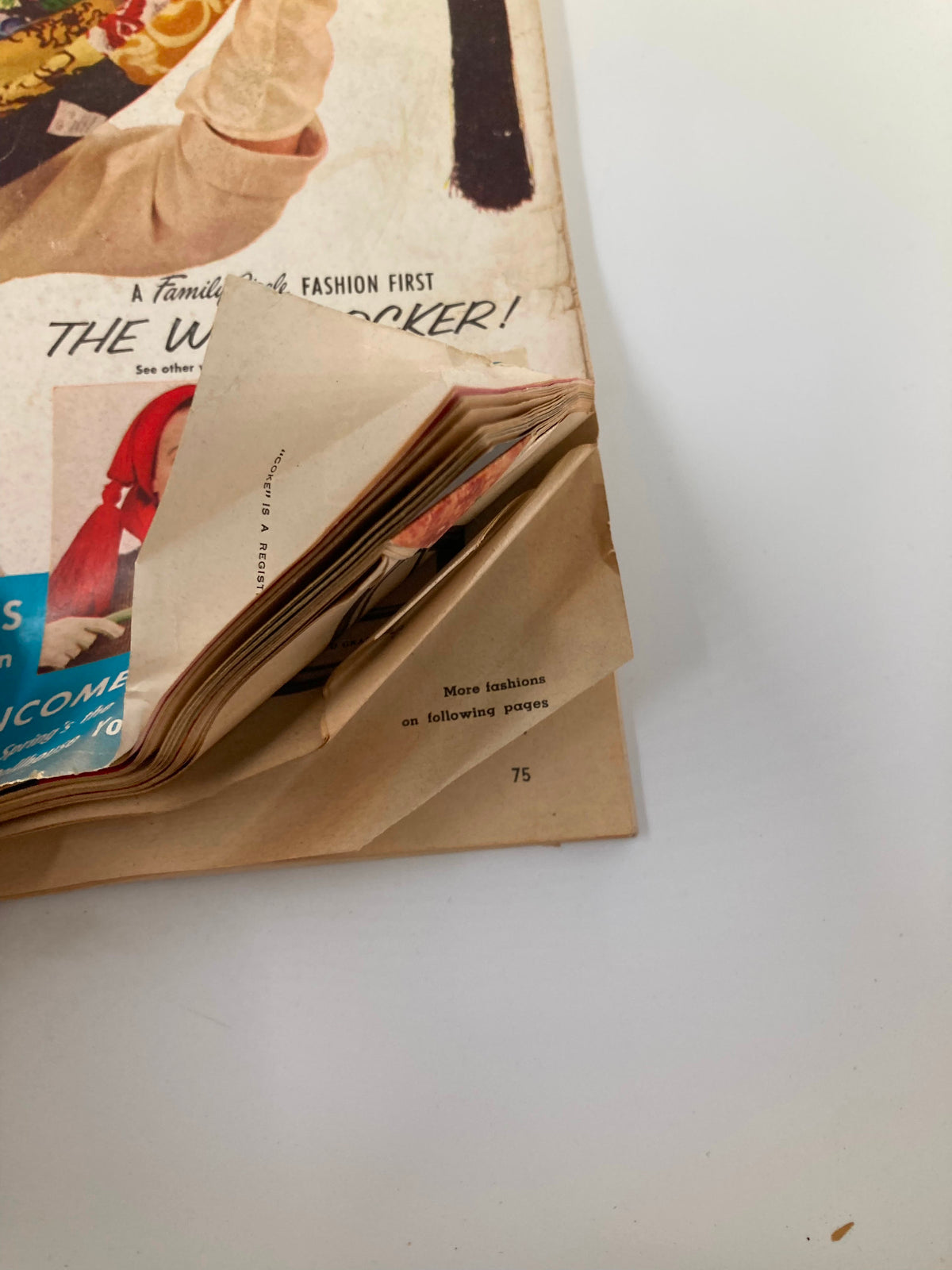 Interior view of the VTG Family Circle Magazine March 1954 showing the binding and pages, highlighting its vintage condition.