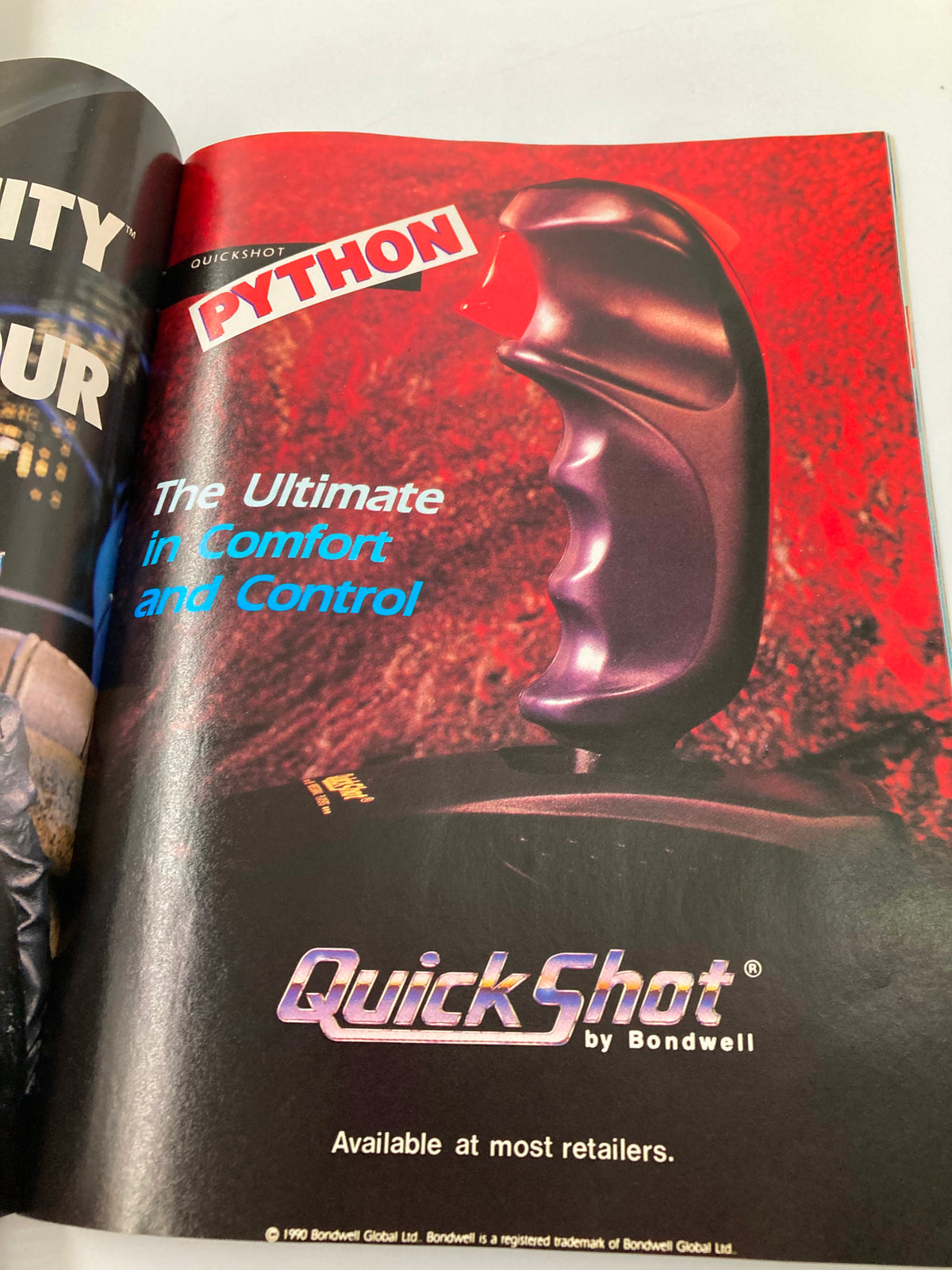 GamePro Magazine August 1990 displays an advertisement for the QuickShot Python joystick, emphasizing its comfort and control for gamers.