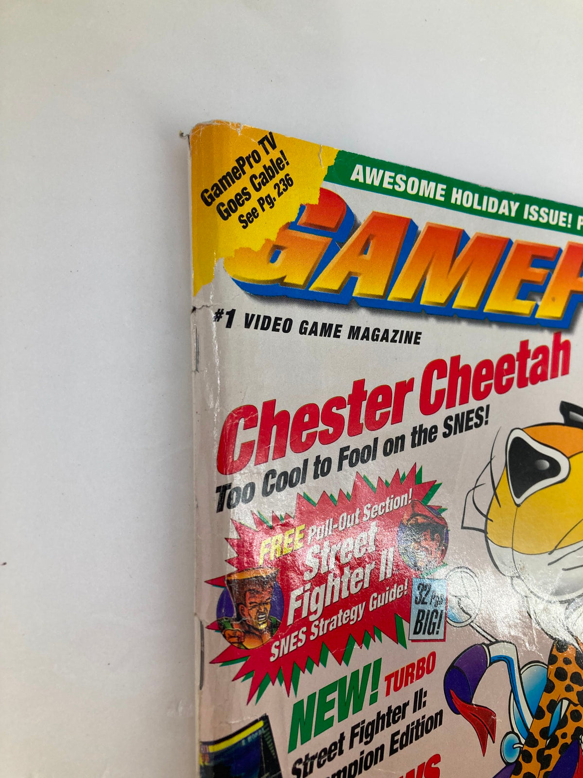 Spine detail of GamePro Magazine Vol 4 #12 highlighting Chester Cheetah and promoting the Street Fighter II strategy guide.