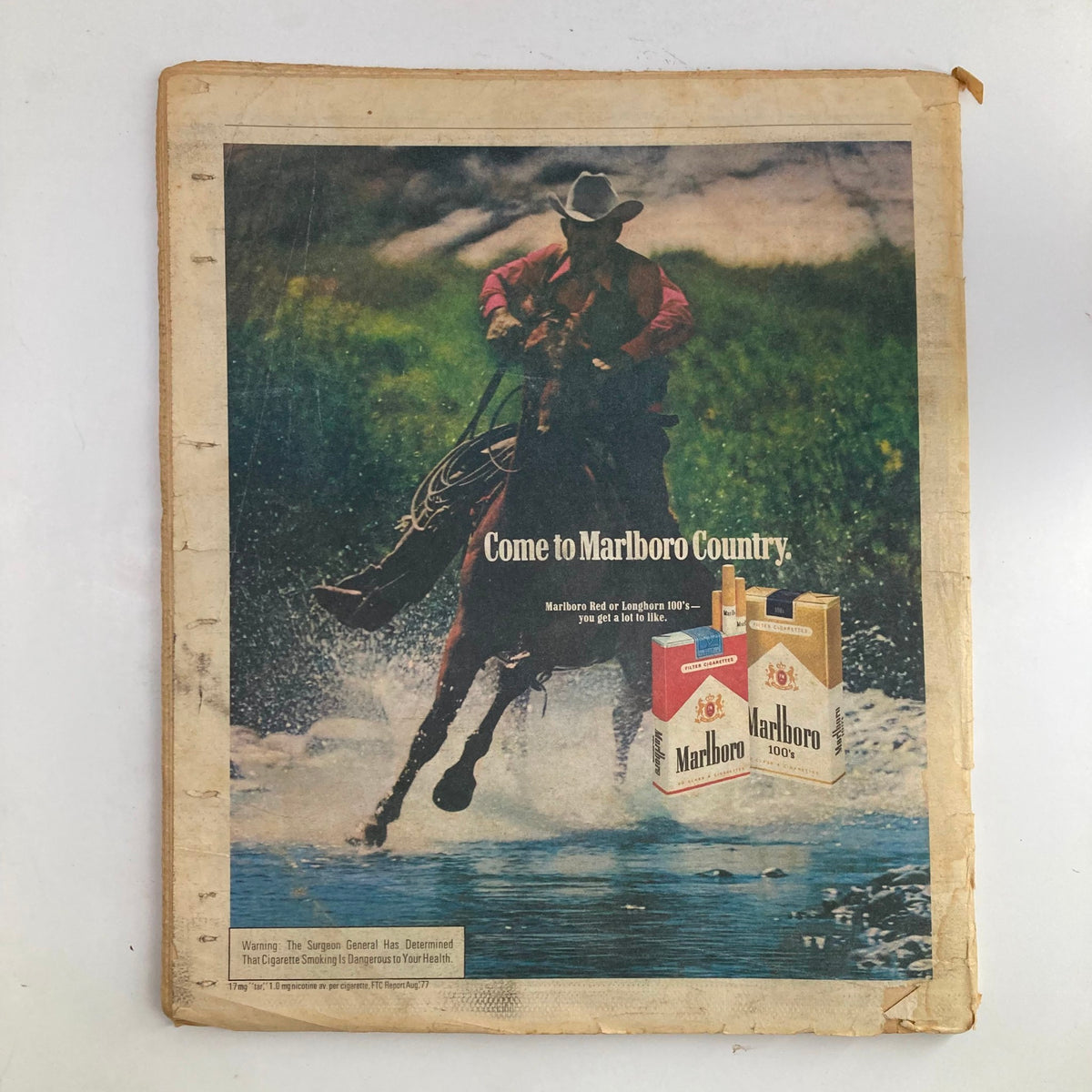 Back cover of Rolling Stone Magazine June 15 1978 with an advertisement for Marlboro cigarettes, depicting a cowboy riding a horse in a natural setting.