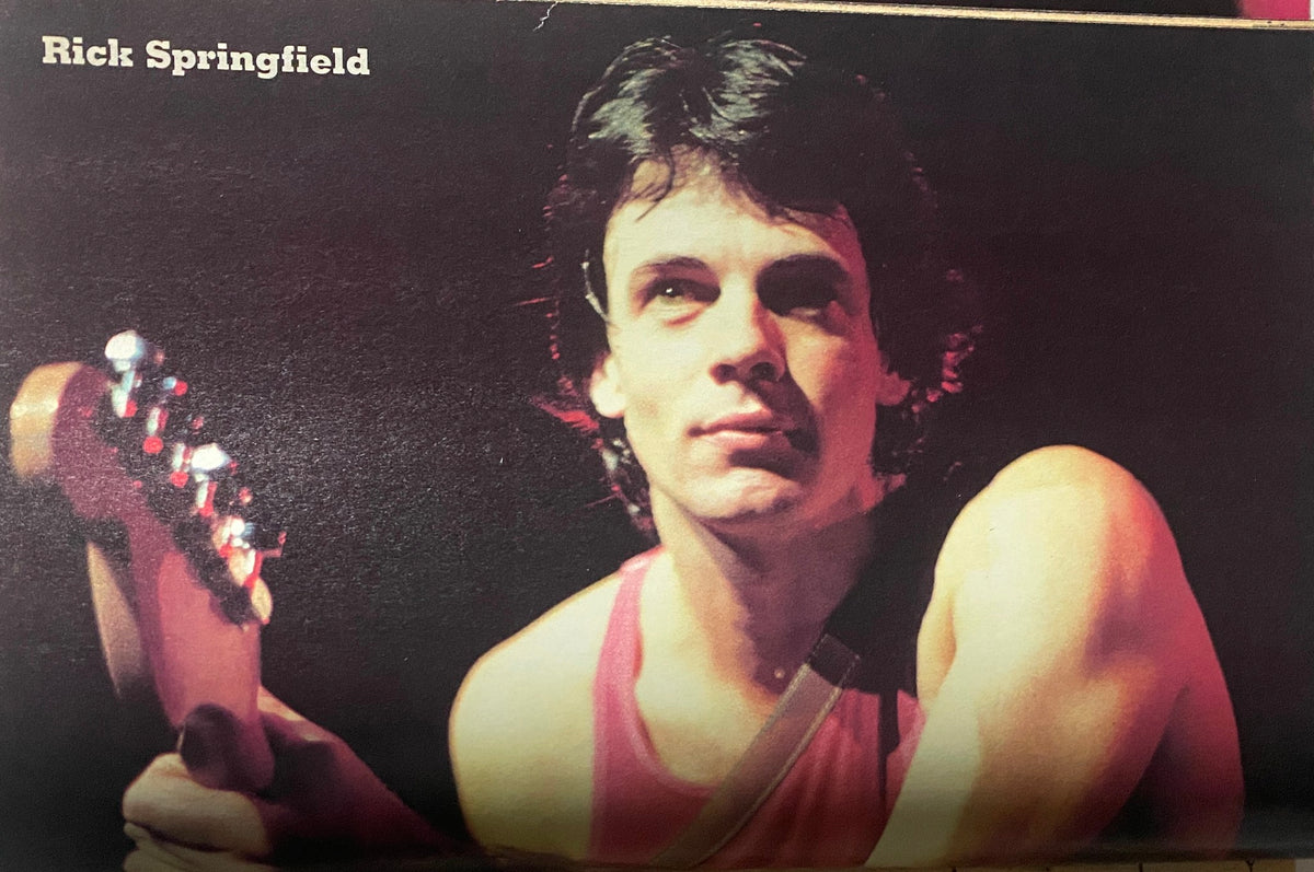 A vibrant image of Rick Springfield featured in 16 Magazine Presents Rock Line Summer 1982, capturing his iconic rock star presence.
