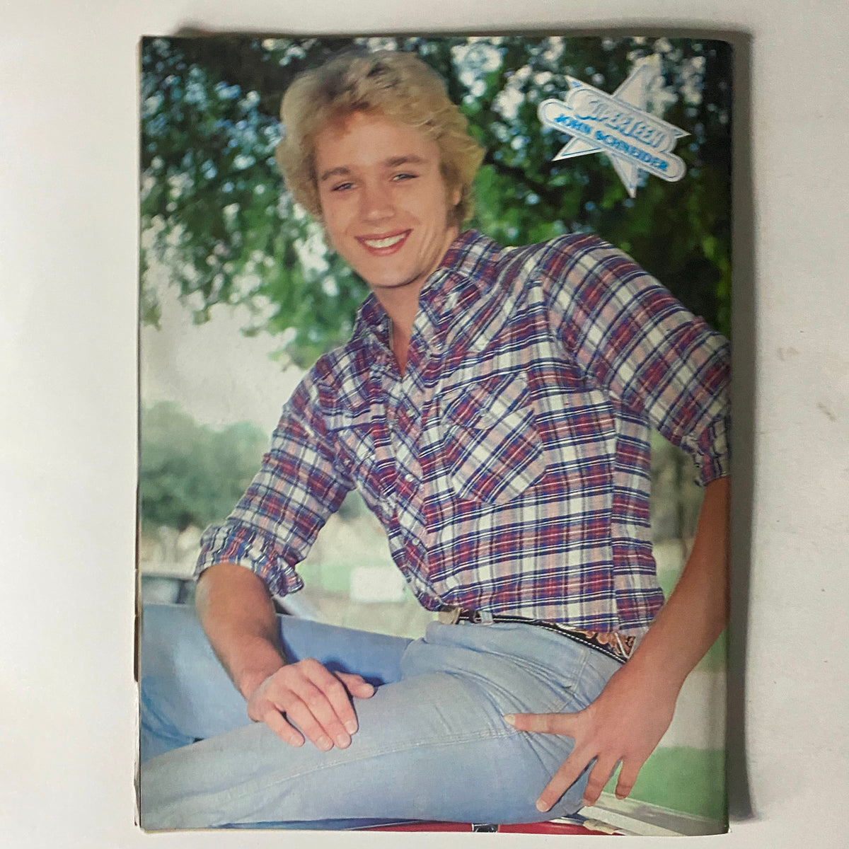 Back cover of SuperTeen Special No. 4 featuring John Schneider in a plaid shirt, reflecting the fashionable trends of the 1981-1982 vintage magazine.