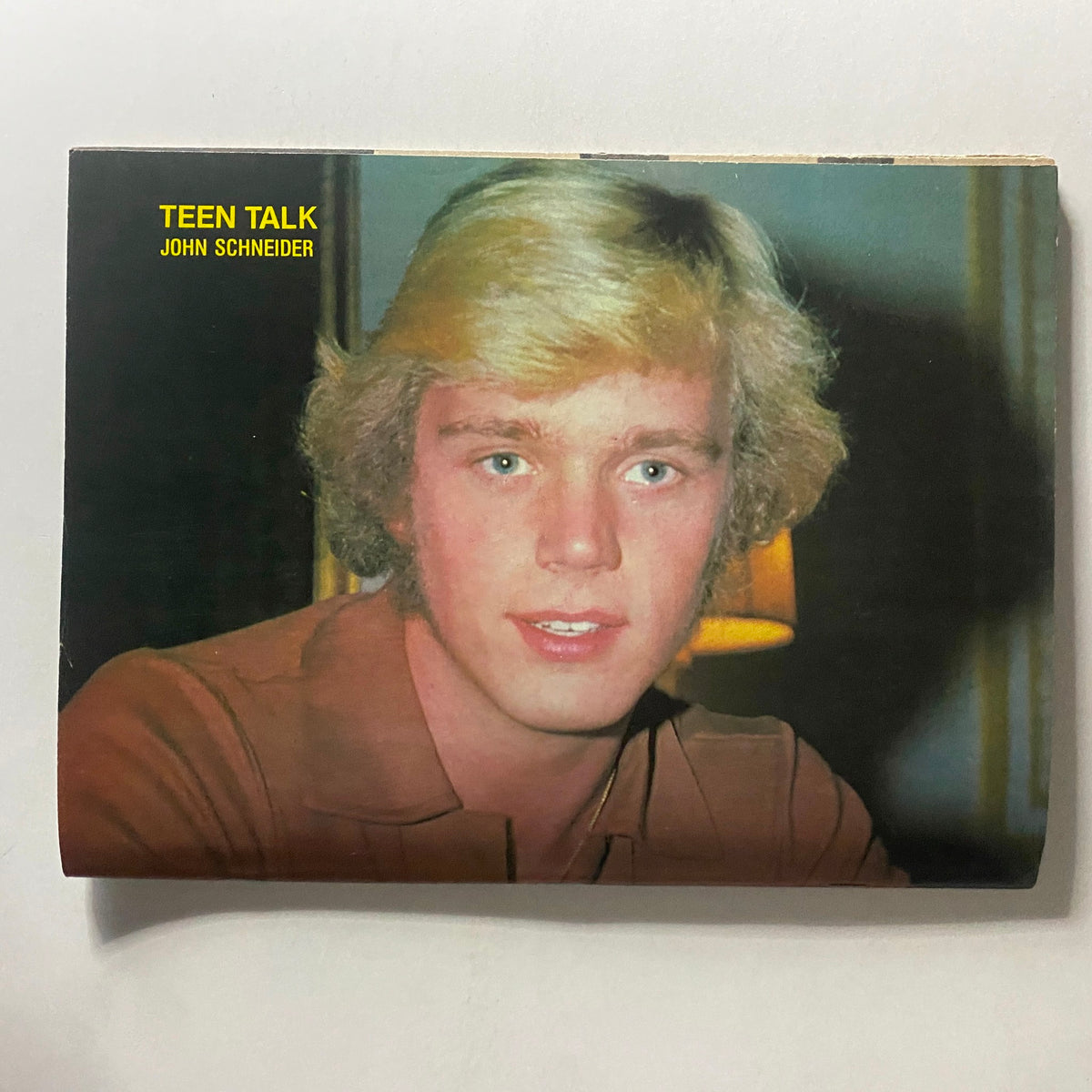 Close-up of John Schneider featured in Teen Talk Magazine June 1981. The image shows a young Schneider with blonde hair, reflecting the vibrant teen culture of the early '80s. A perfect collectible for fans of Teen Talk Magazine and classic celebrity memorabilia.