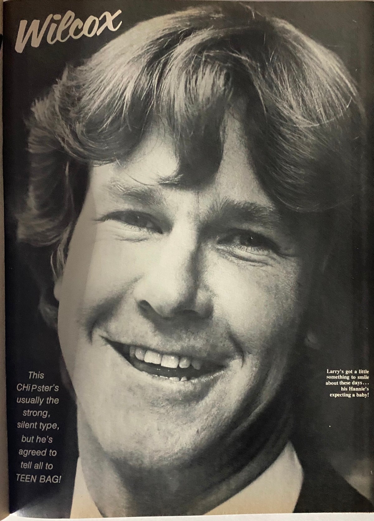 A smiling adult male with long hair in black and white, associated with Teen Bag Magazine May 1981.