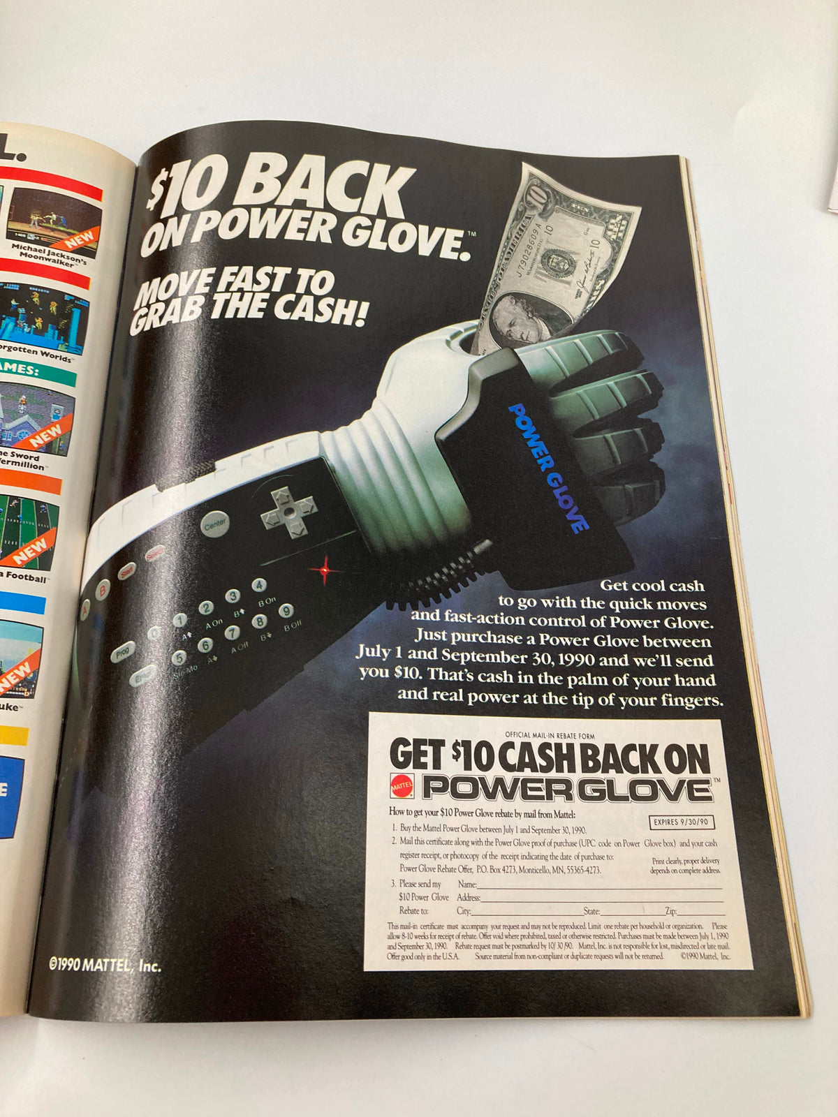 Advertisement from GamePro Magazine September 1990 promoting the Power Glove gaming accessory from Mattel. Features striking visuals focused on cash rebate offer.