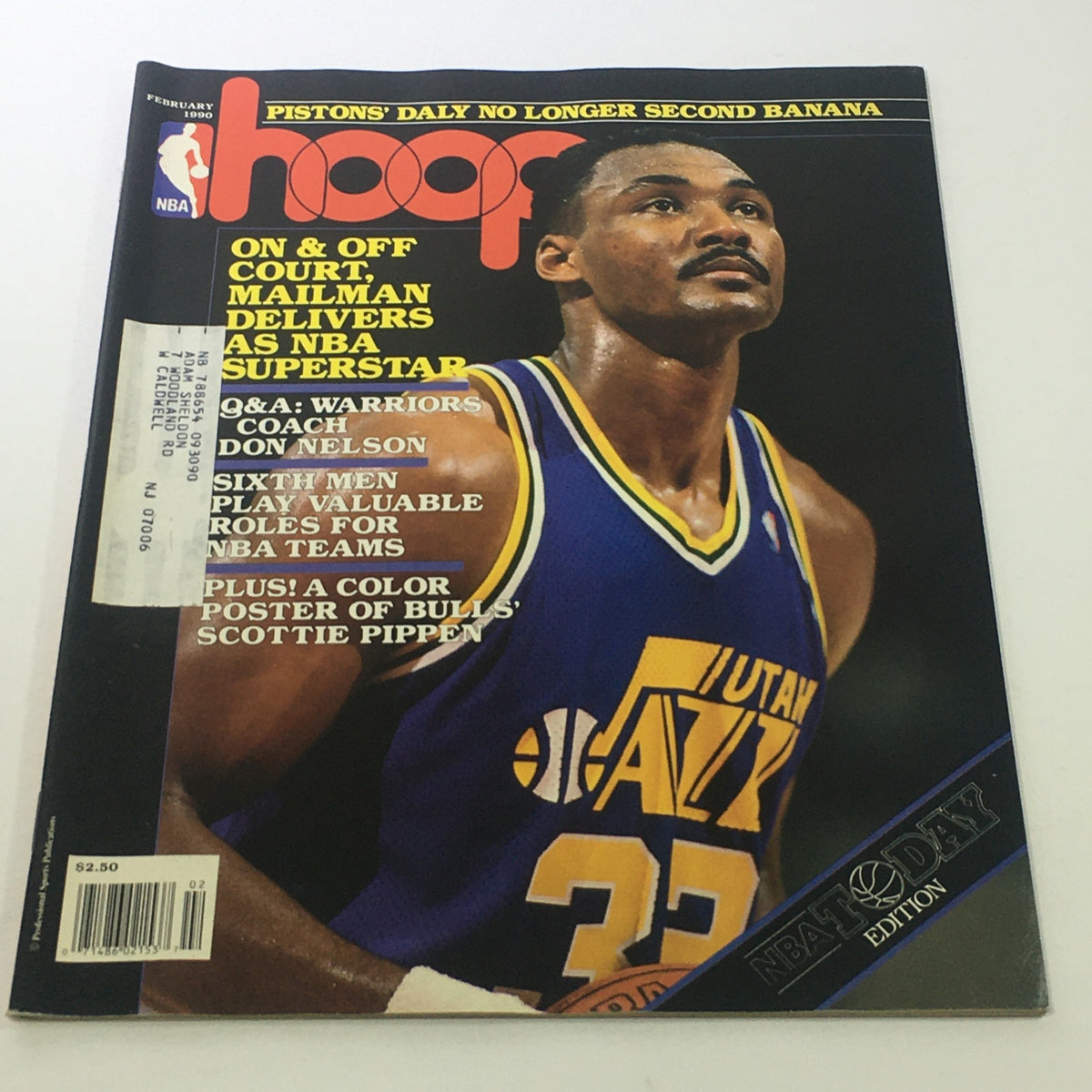 Cover of Hoop NBA Magazine, February 1990 featuring Karl Malone, known as the 'Mailman,' showcasing his contributions as an NBA superstar and highlights from the league.