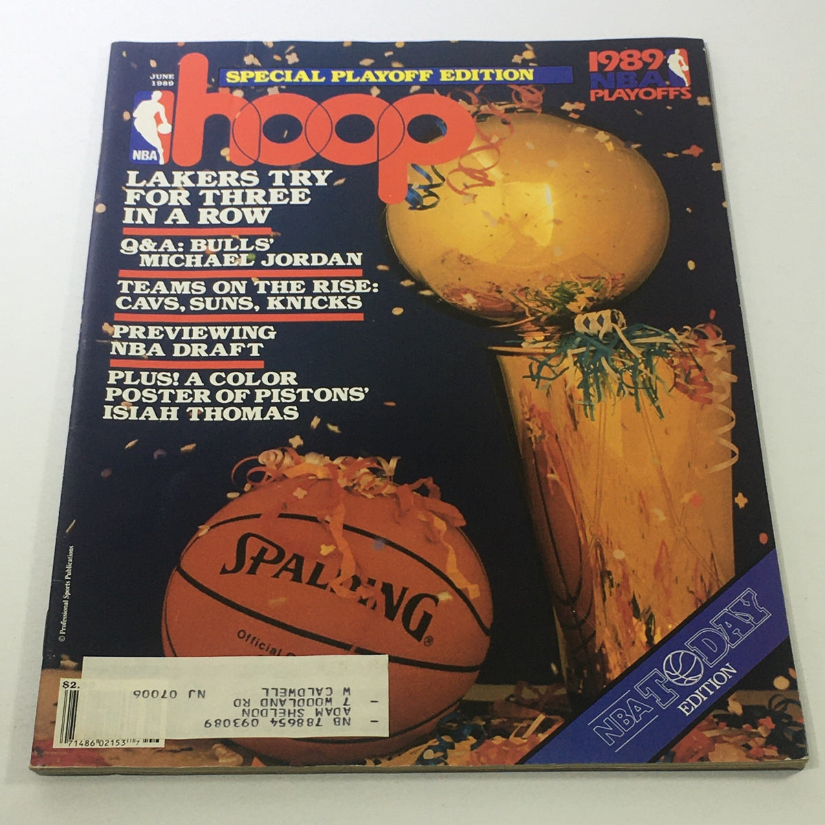 Cover of Hoop NBA Magazine: June 1990 - Lakers Try For Three In A Row For Playoffs, featuring an iconic basketball design with the NBA trophy and a Spalding basketball.