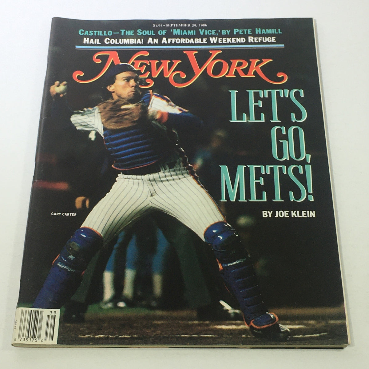 Cover of New York Magazine from September 29, 1986, featuring the title 'Let's Go Mets!' by Joe Klein, showcasing a baseball catcher in action, representing the excitement of the New York Mets.