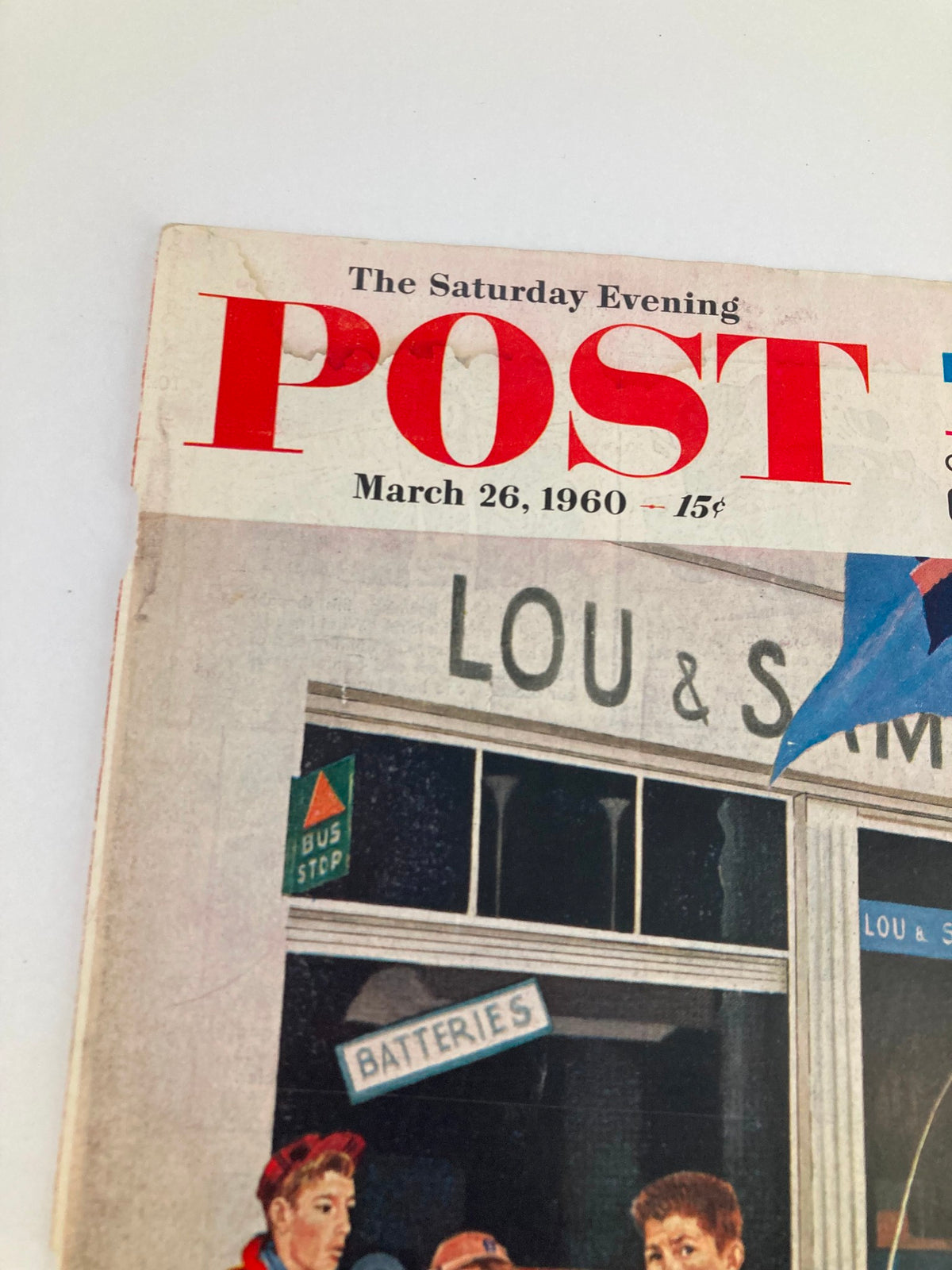 Detailed view of the top header from The Saturday Evening Post March 26, 1960 cover, displaying the magazine’s title and an advertisement for Lou & Sam's.