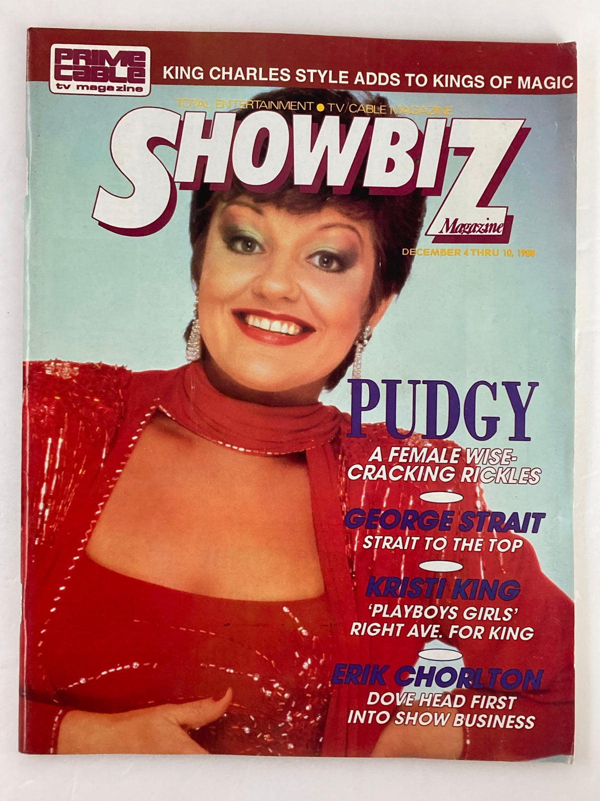 Showbiz Magazine cover from December 4, 1988, featuring Pudgy, George Strait, and Kristi King, showcasing vibrant colors and pop culture icons.