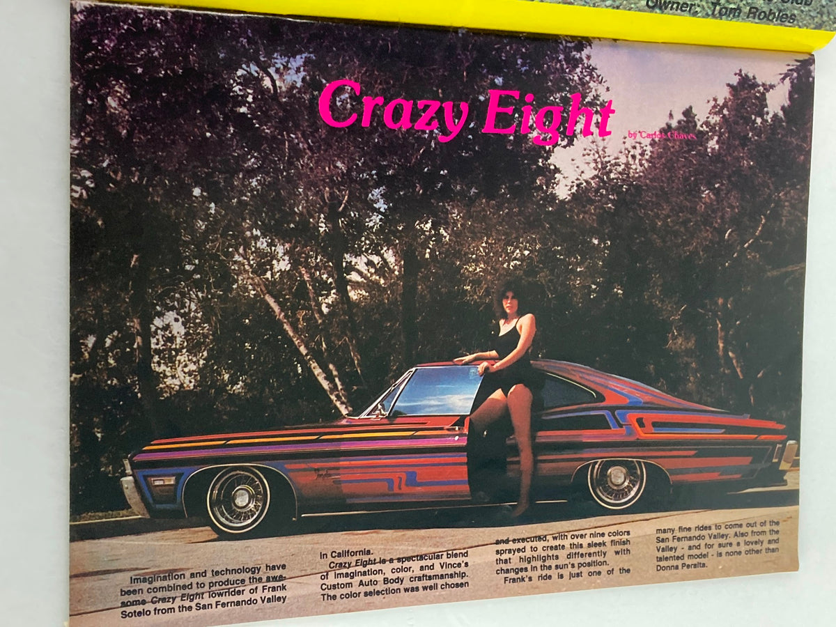 Full-page feature in VTG LowRider Magazine December 1983 highlighting the 'Crazy Eight' lowrider with a vibrant color scheme and a model posing next to the car.
