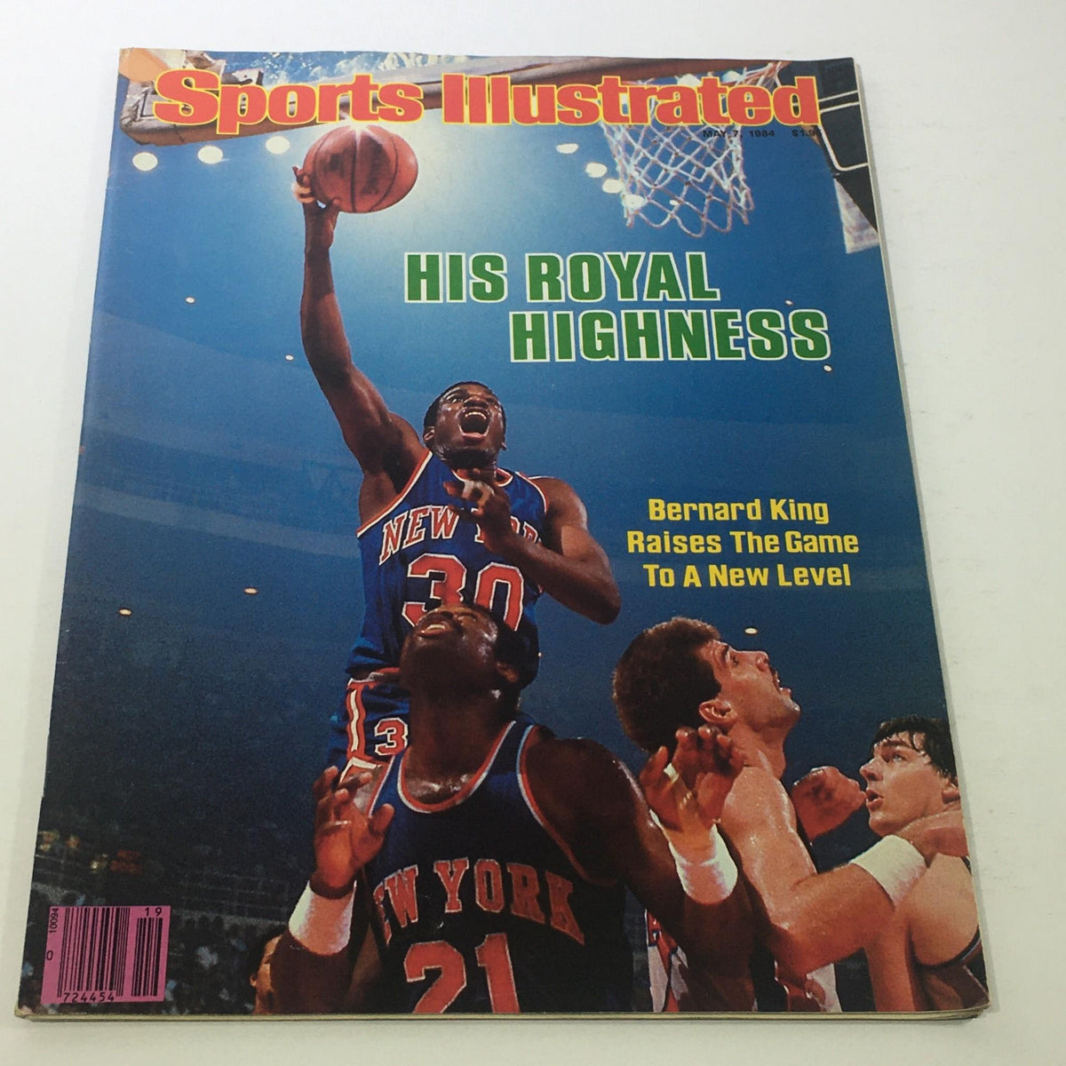 Sports Illustrated May 7 1984 magazine cover featuring Bernard King, captioned 'His Royal Highness', showcasing a dynamic basketball scene with players from the New York Knicks.