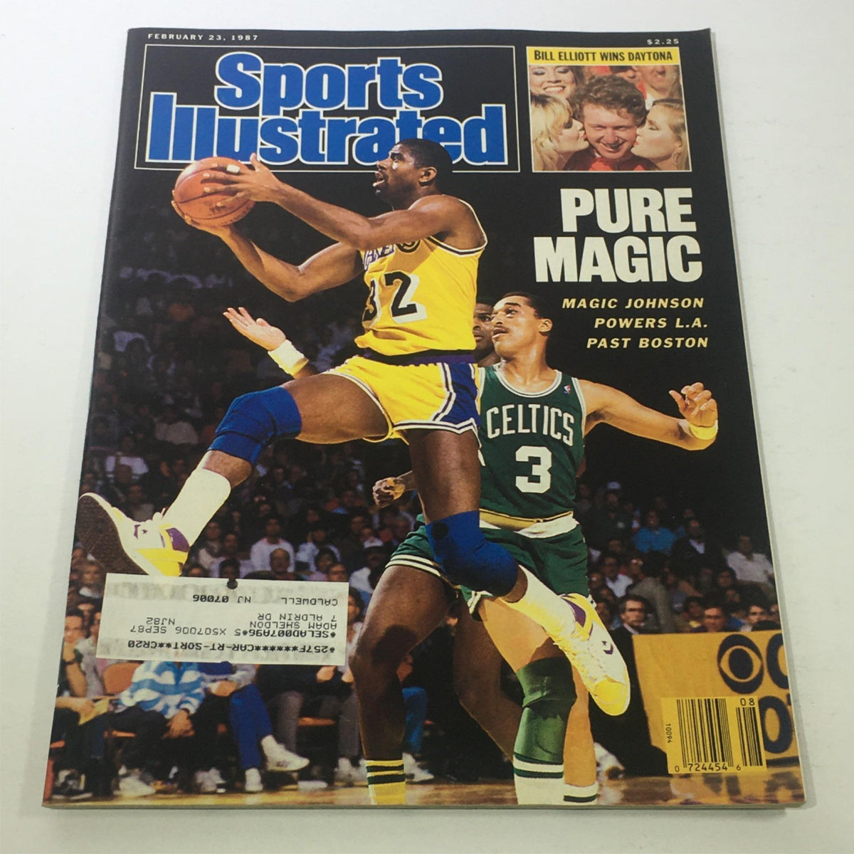 Sports Illustrated February 23, 1987 magazine cover featuring Magic Johnson in action, showcasing his iconic performance that led the Los Angeles Lakers past the Boston Celtics.