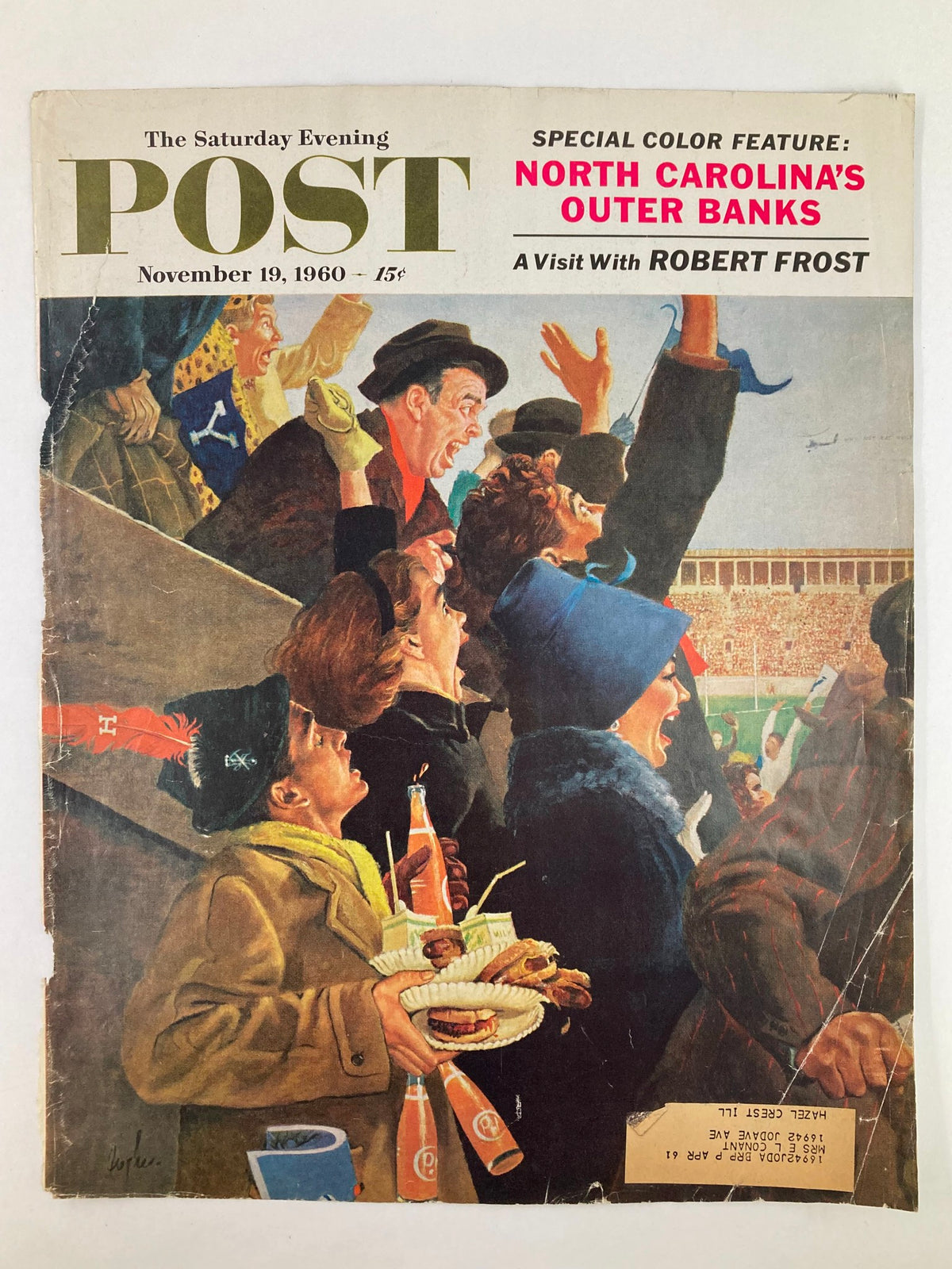 Cover of The Saturday Evening Post November 19, 1960, highlighting a visit with Robert Frost, depicting an enthusiastic crowd holding snacks at a lively event.