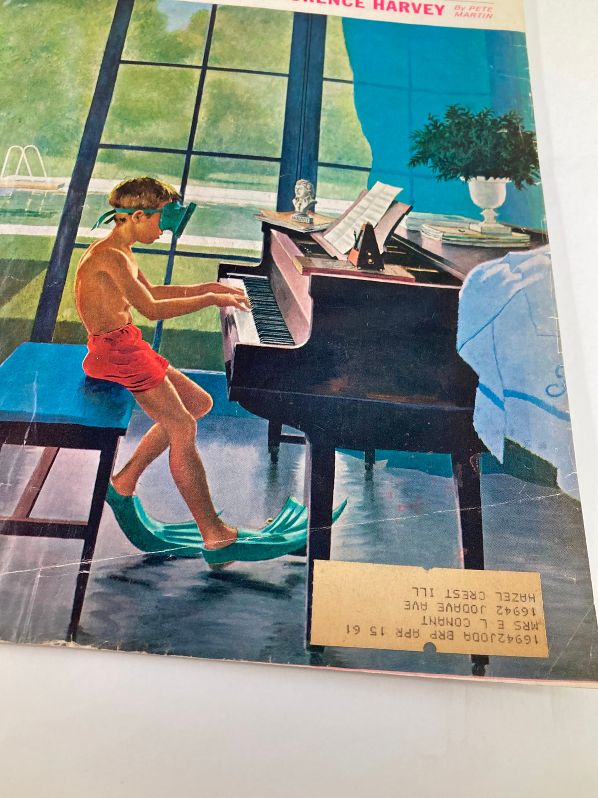 Detail of The Saturday Evening Post cover from June 11, 1960 titled 'My Friend, Trotsky's Assassin', focusing on a boy in flippers at a piano, with a swimming pool and garden visible through the window.