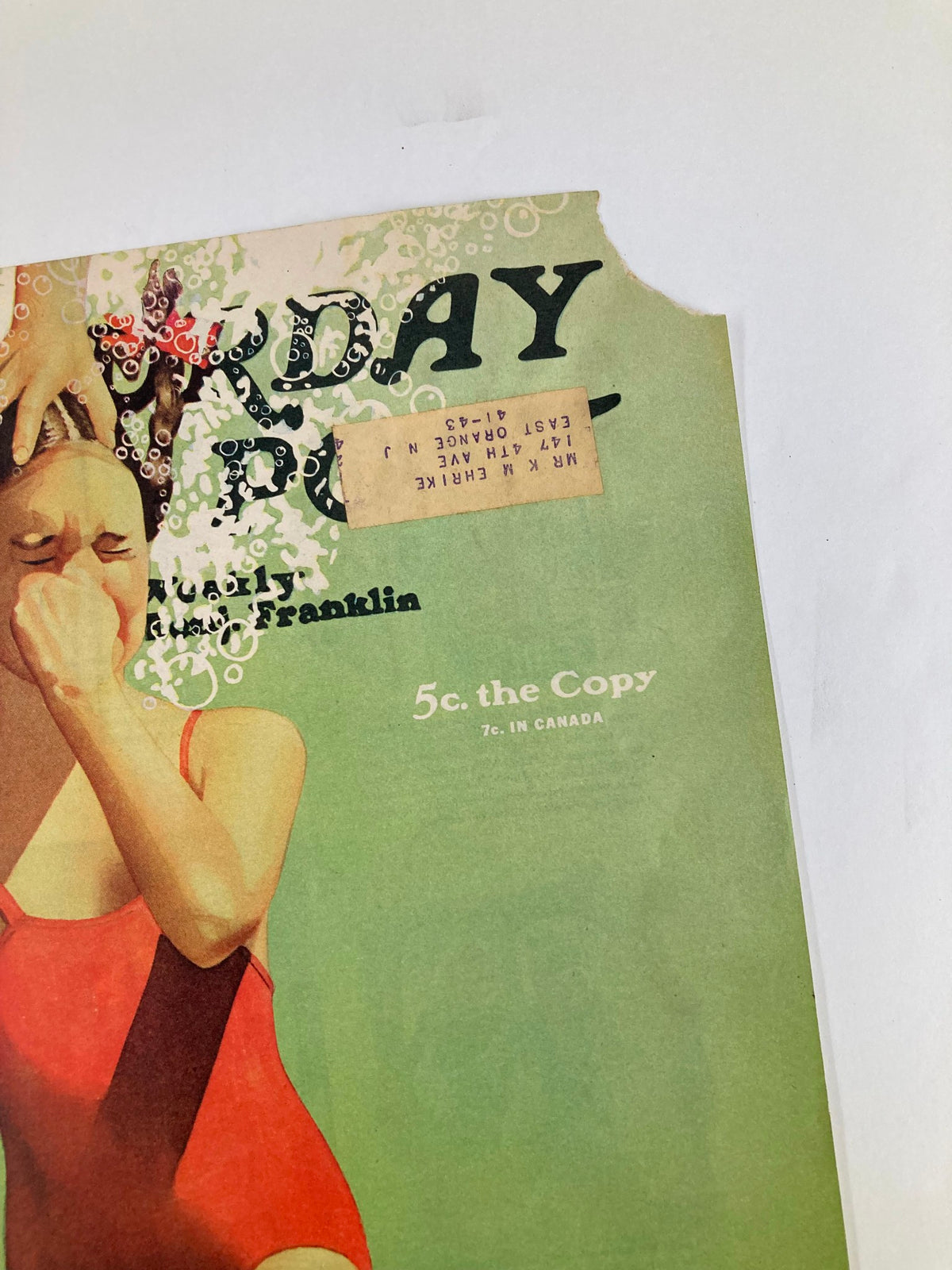 Detail of The Saturday Evening Post cover from August 9, 1941, titled 'Let The Gun Talk,' highlighting the cover's vintage design, featuring a girl in a red swimsuit.