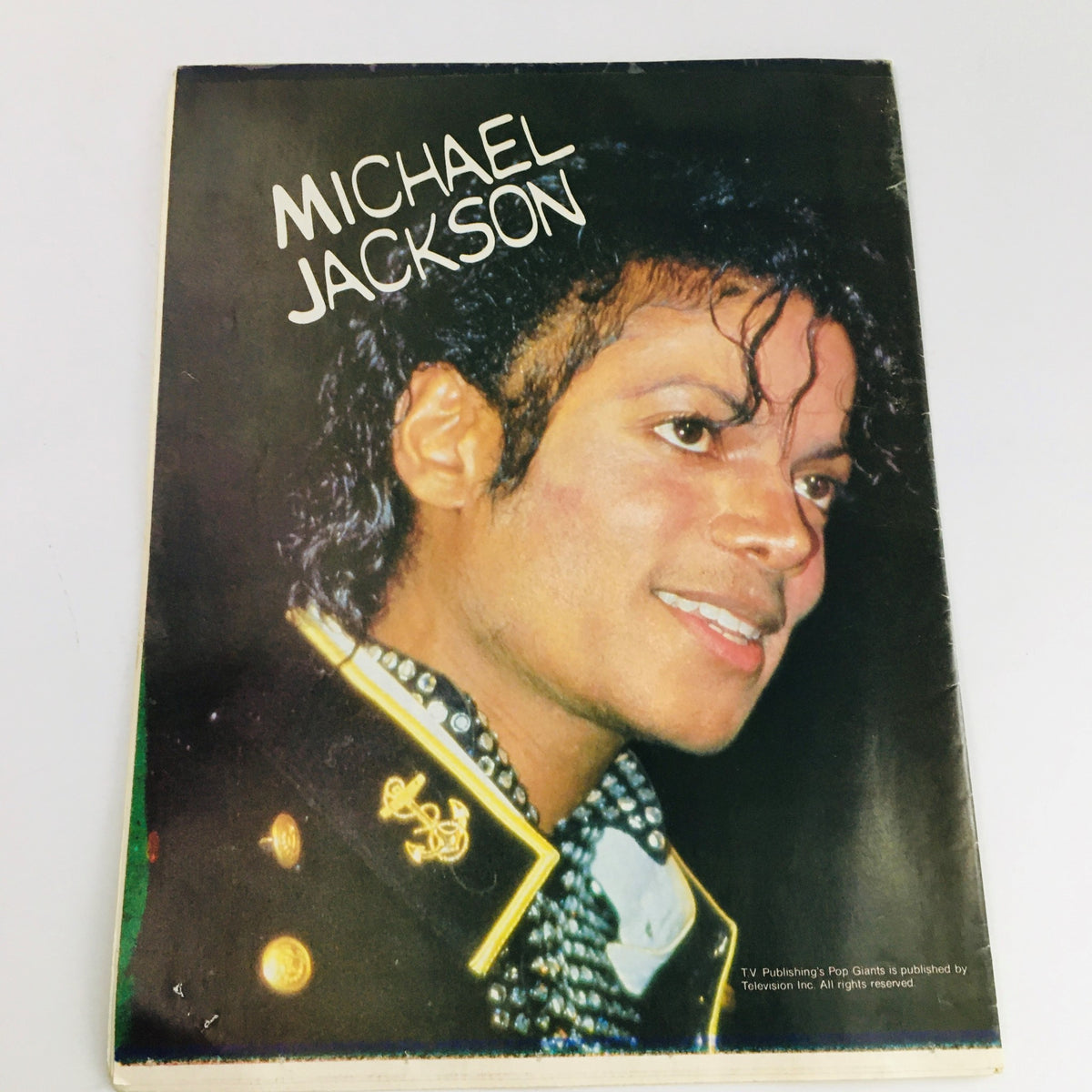 Back cover of Pop TV Giants Poster Magazine 1984 featuring a striking headshot of Michael Jackson with a stylish look.