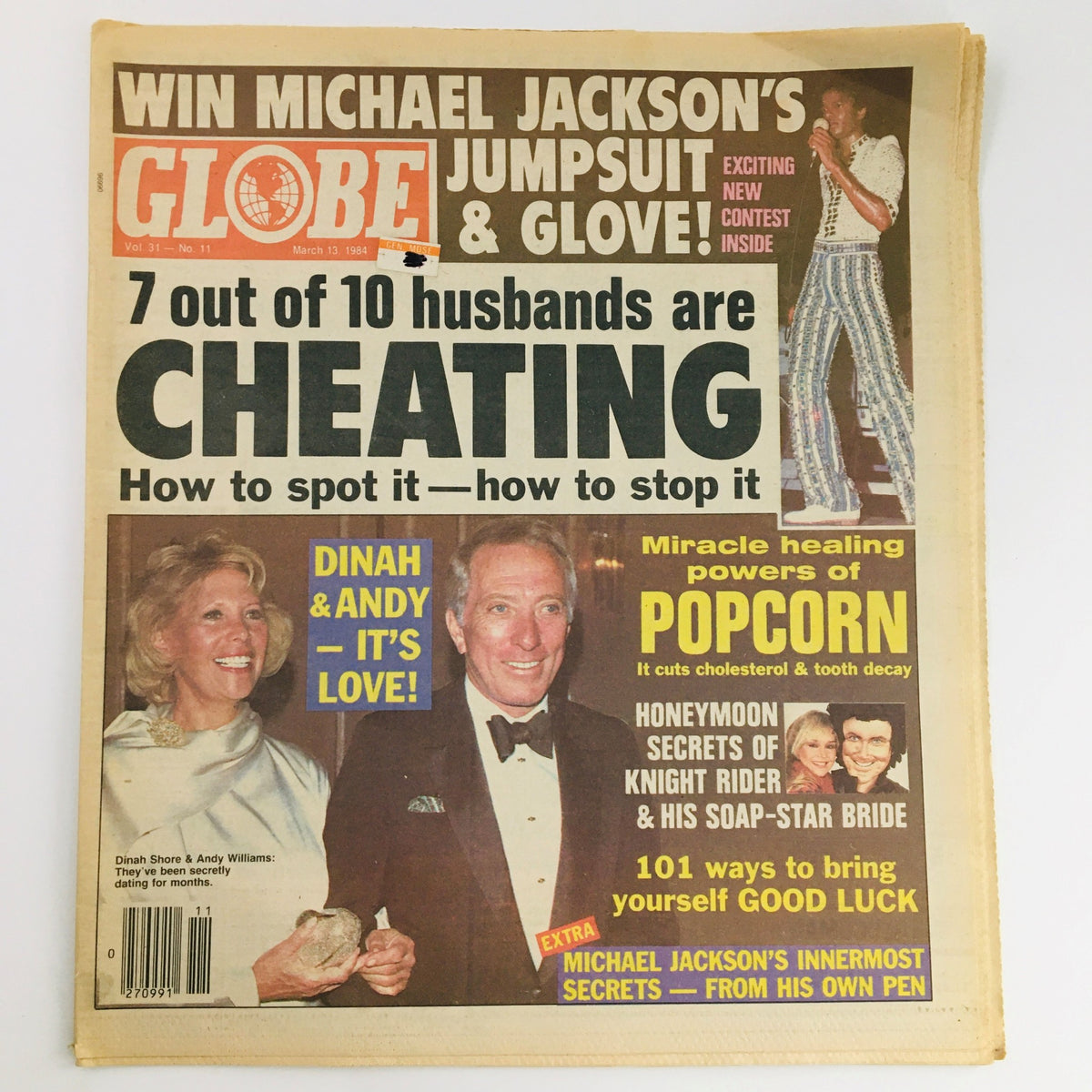 Cover of Globe Newspaper Vol 31 #11 dated March 13, 1984, featuring a headline about Michael Jackson's jumpsuit and glove, alongside a story on cheating husbands. The image shows Dinah Shore and Andy Williams smiling, indicating their romantic relationship, and includes various eye-catching headlines and colorful graphics.