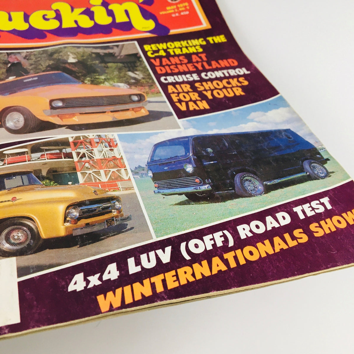 Close-up of Truckin' Magazine May 1976 Vol 2 #5 highlighting articles on Reworking The C-4 Trans and showcasing various vans, including a black van and yellow truck.