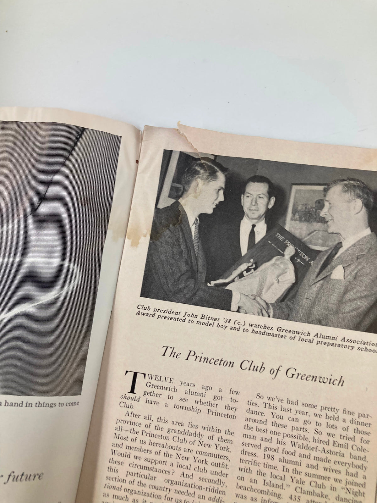 Interior page of the VTG Princeton Alumni Weekly from March 13, 1959, showing Club President John Bitner '38 observing an award presentation at the Greenwich Alumni Association event.