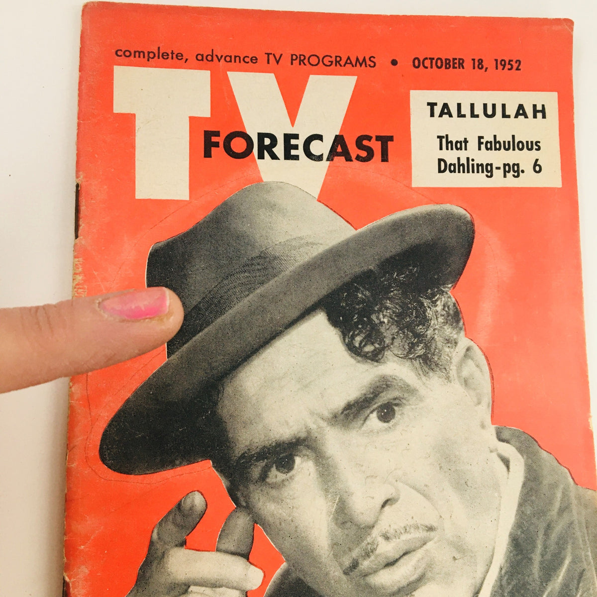 Close-up of the cover of TV Forecast Magazine, dated October 18, 1952, showcasing Tallulah Bankhead and Luigi. The image highlights the vintage style and importance of this issue in television history.