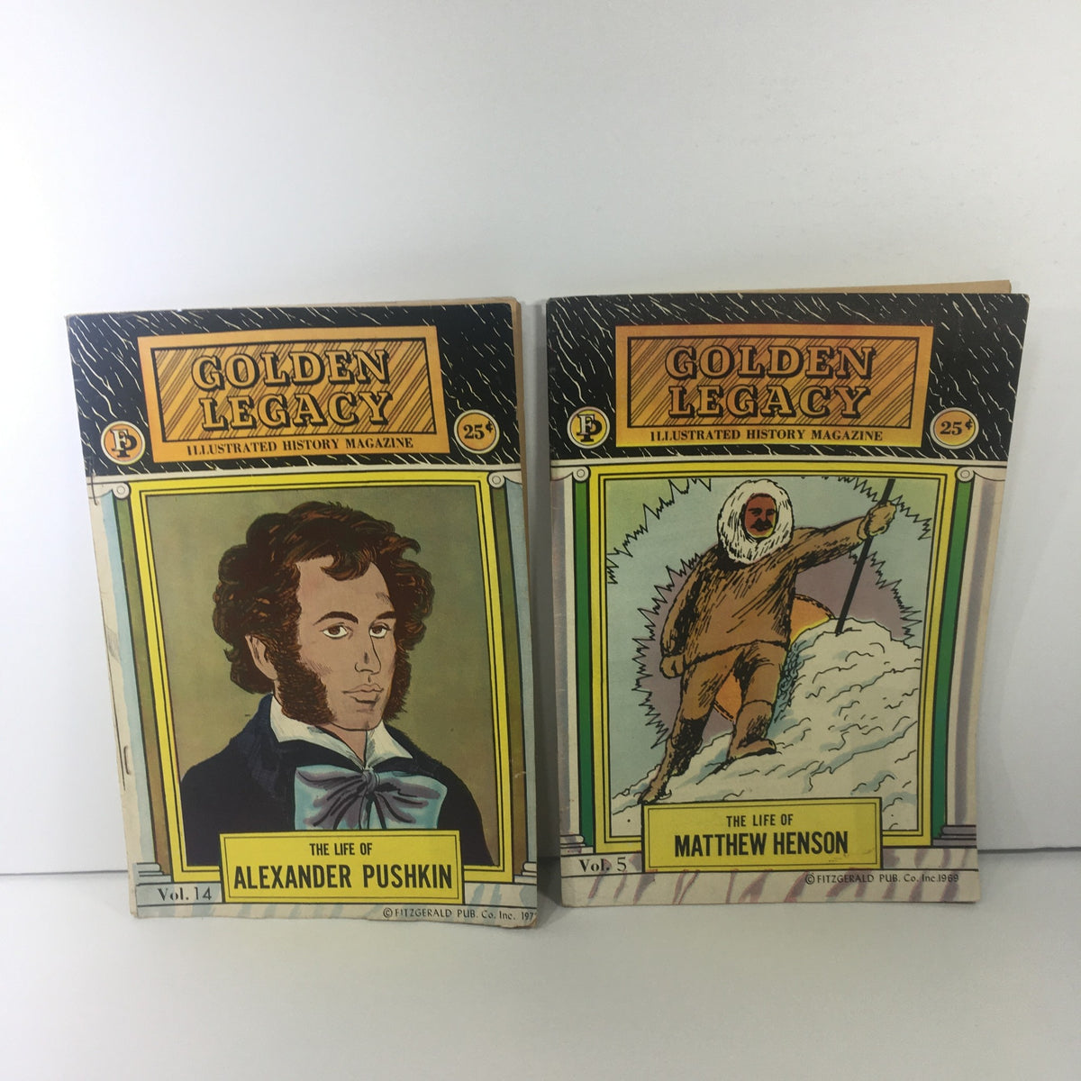 Golden Legacy Illustrated History Magazines displaying Volume 14 'The Life of Alexander Pushkin' and Volume 5 'The Life of Matthew Henson'.