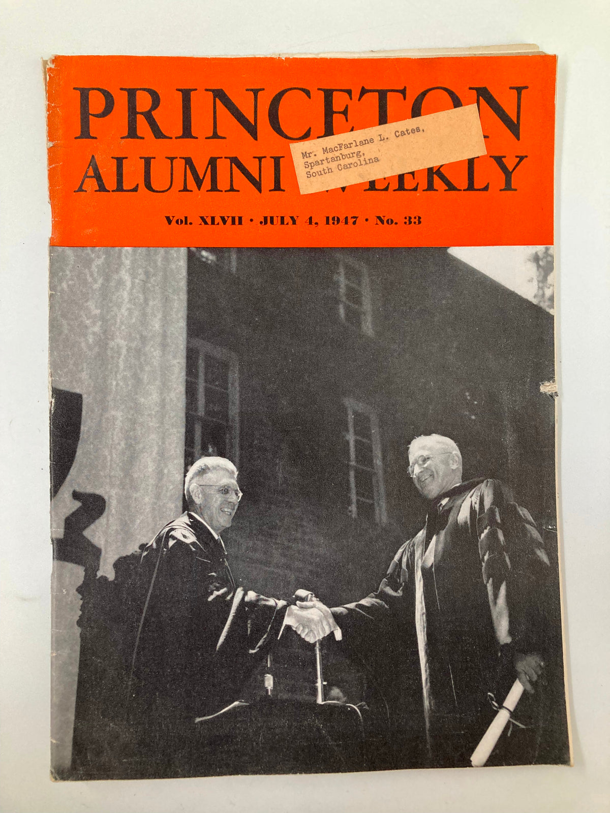 Cover of VTG Princeton Alumni Weekly July 4, 1947, featuring a historical photograph of two figures shaking hands outside McCarter Theatre.