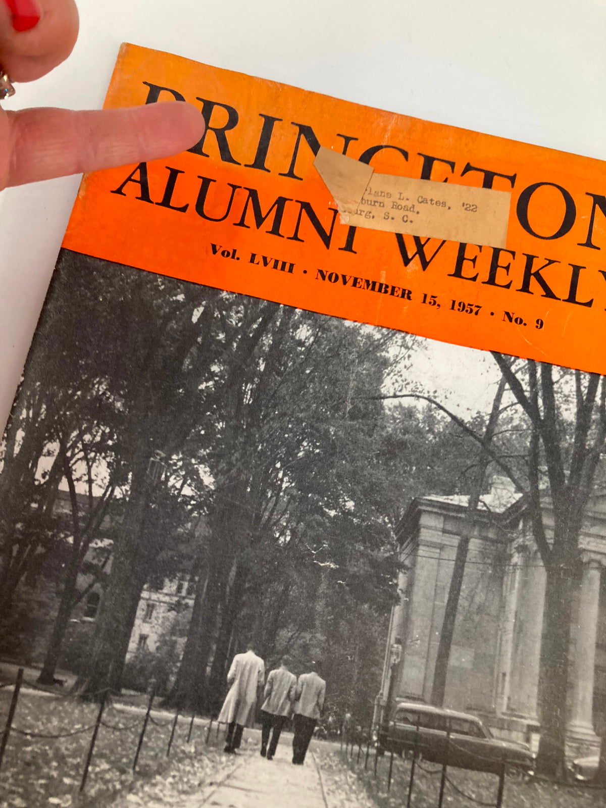 Close-up of VTG Princeton Alumni Weekly November 15, 1957, cover, highlighting the title and a label indicating the previous owner, enhancing its vintage appeal.