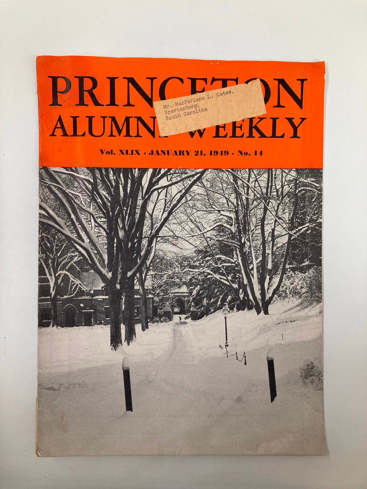VTG Princeton Alumni Weekly from January 21, 1949, featuring a snow-covered Princeton campus on the cover, showcasing a serene winter scene.