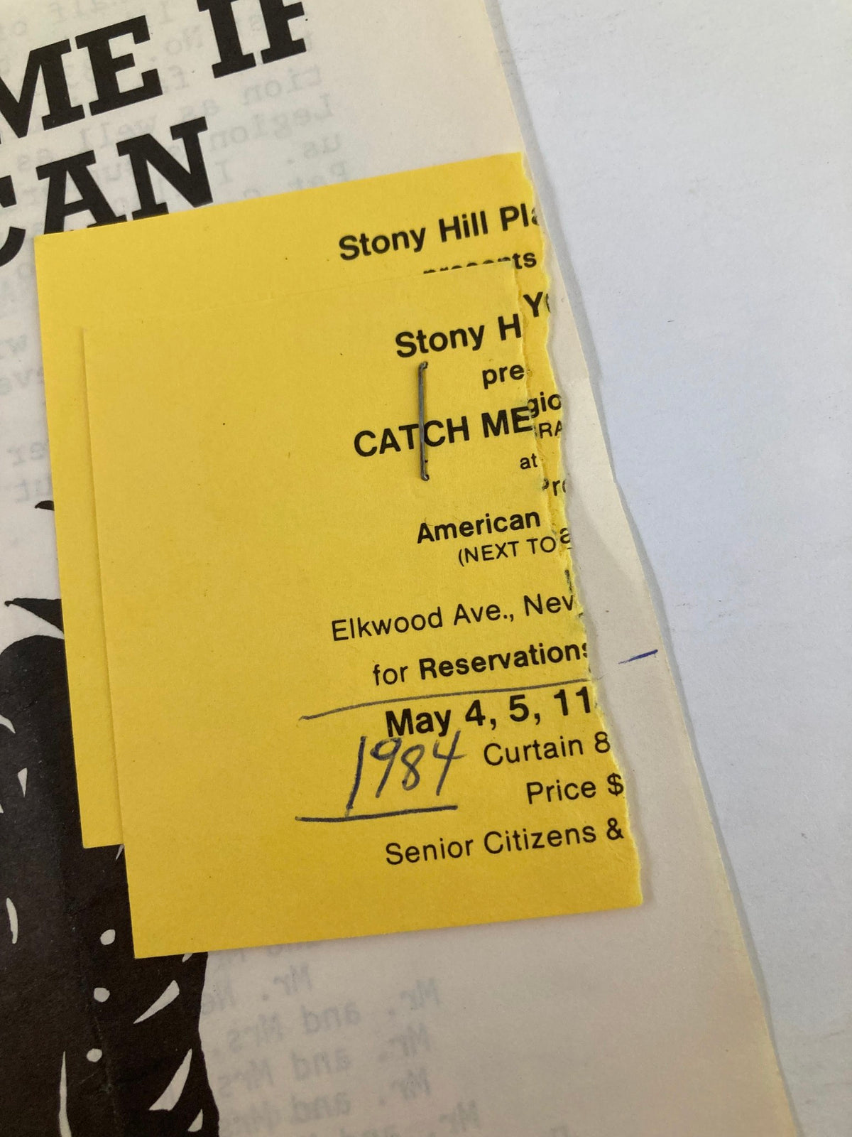 Close-up of the ticket attached to the 'Catch Me If You Can' program from the 1984 Stony Hill Players production, with details including reservation information and performance dates.