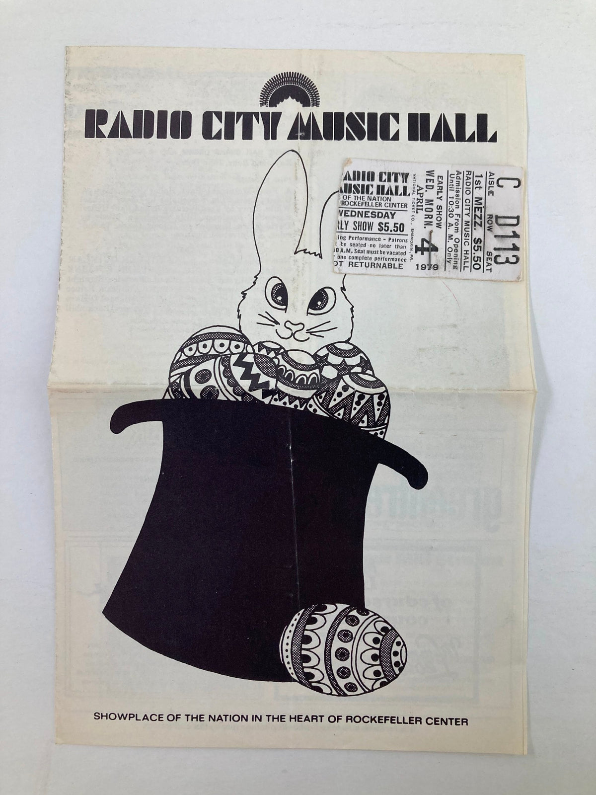 1979 Program Radio City Music Hall featuring a cartoon rabbit design and a ticket stub attached, showcasing nostalgic entertainment history.