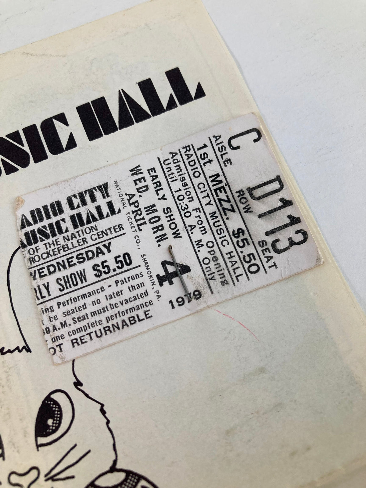 Close-up view of the ticket stub from the 1979 Program Radio City Music Hall, detailing the date and seat information, a collectible memorabilia piece.