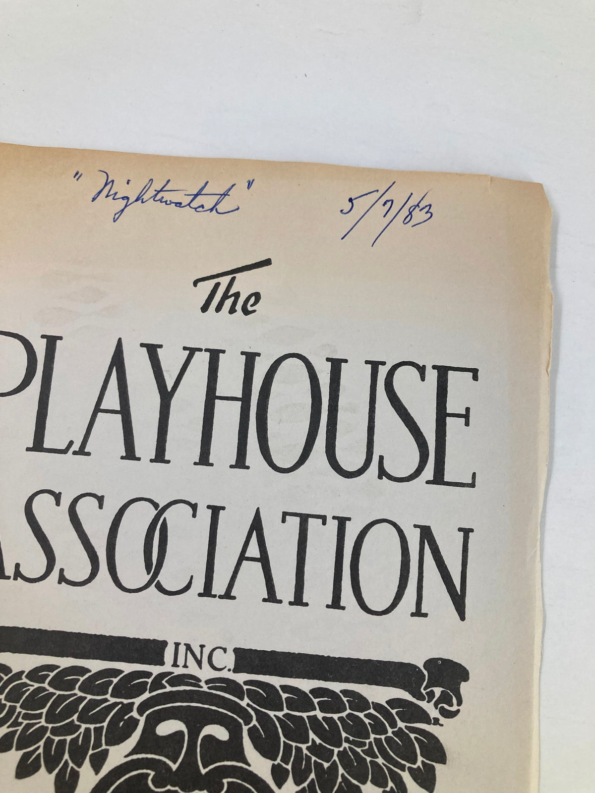 Close-up of the top section of the 1983 Program 'The Playhouse Association Night Watch' showing handwritten date and notes on the cover.