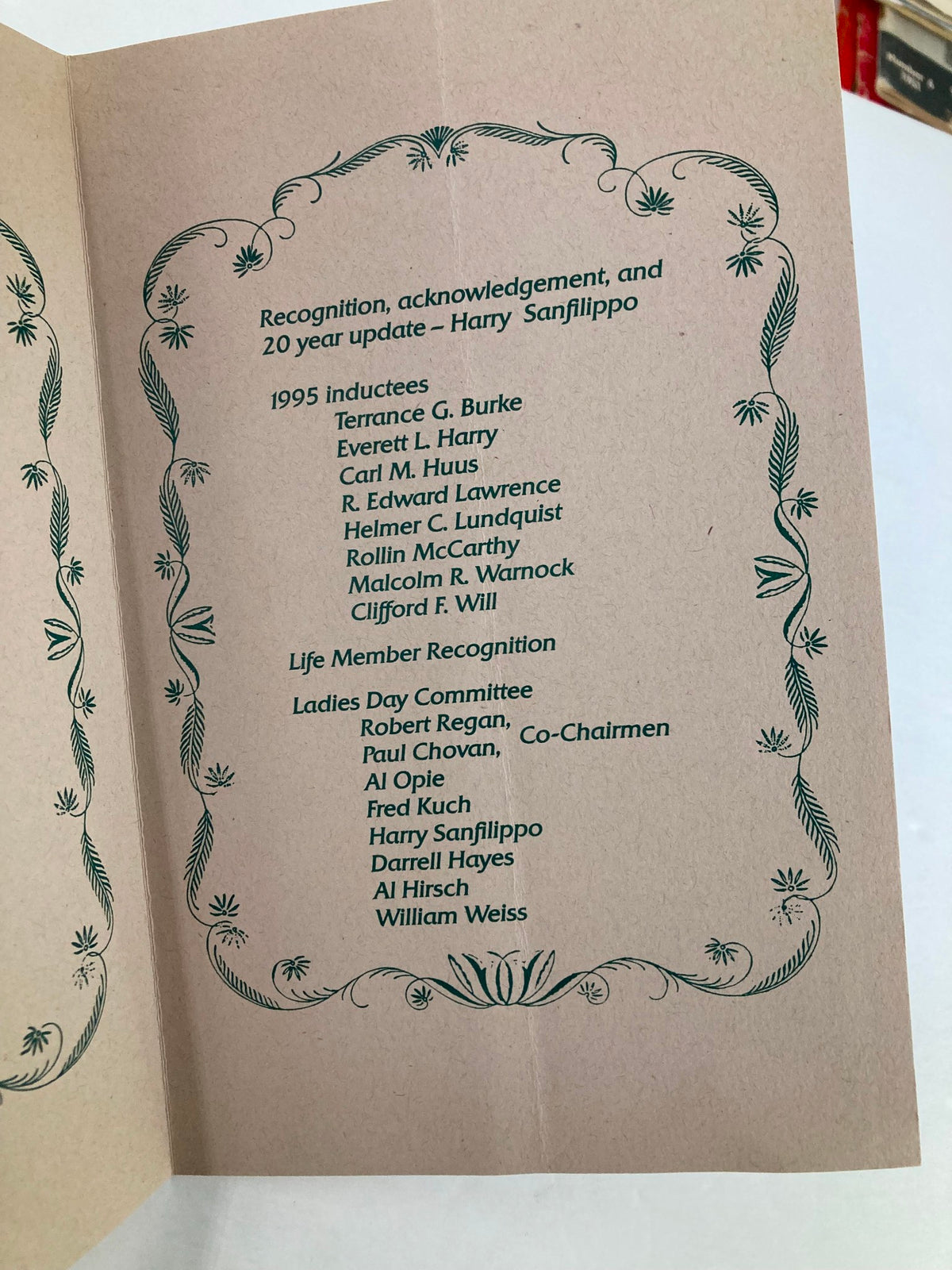1995 Program Summit Old Guard Ladies Day Luncheon and Entertainment showing the inside cover with names of inductees and life members, including Harry Sanfilippo and committee members.