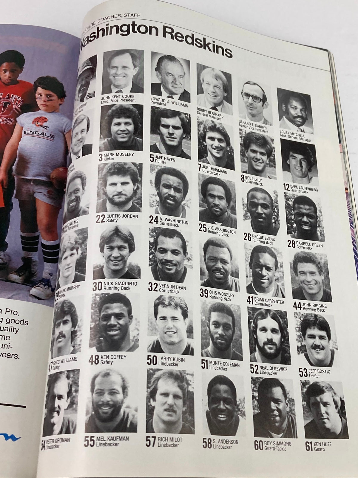 Washington Redskins team photo including players and coaches from the 1984 NFL Super Bowl XVIII Magazine, showcasing the AFC vs NFC championship.