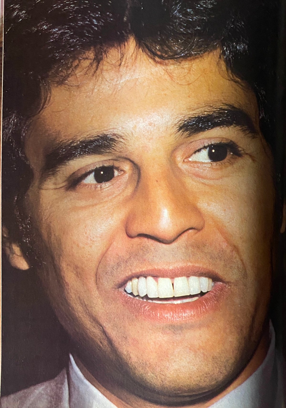 Close-up portrait of a smiling male celebrity featured in Tiger Beat Magazine, April 1981, showcasing his gleaming teeth and stylish hair.
