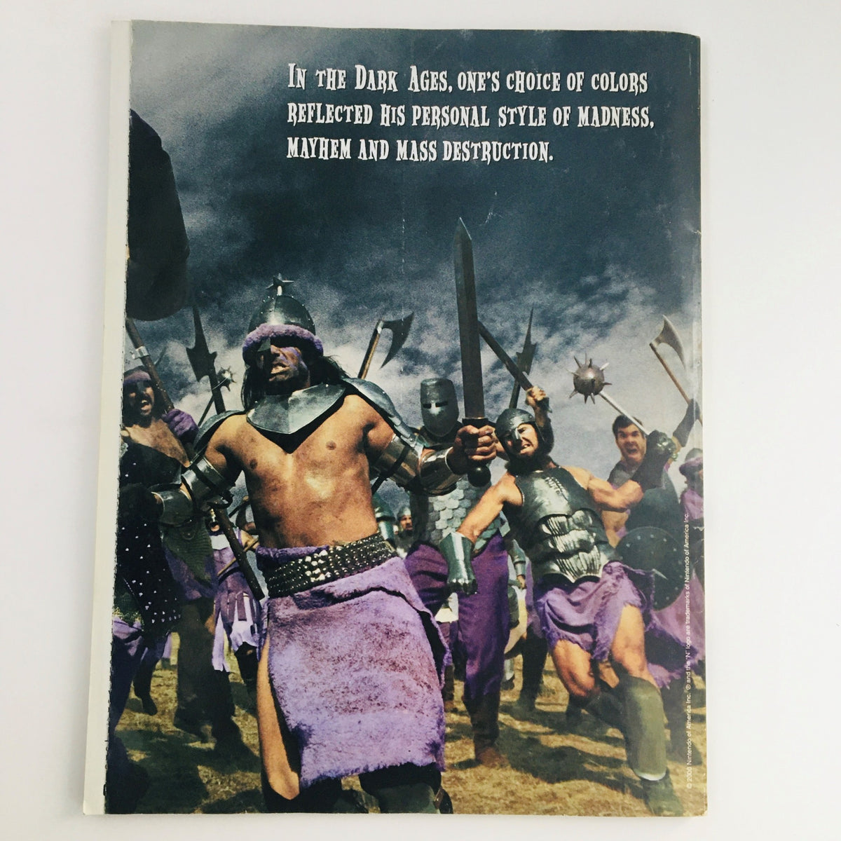 Back cover of Nintendo Power Magazine March 2000 Vol 130 with an artistic depiction of medieval warriors, showcasing its vintage design.