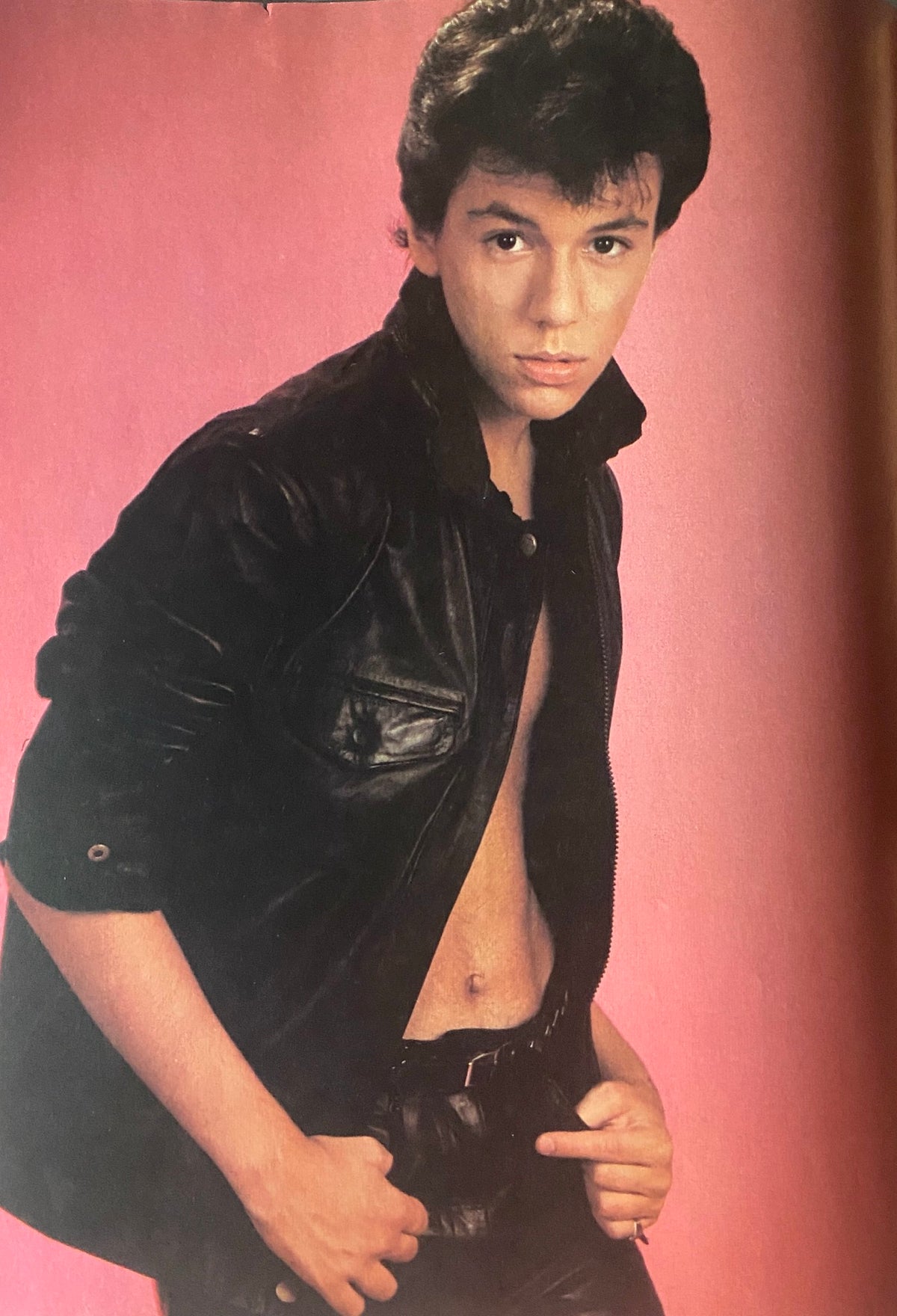 A young male model posing in leather jacket featured in Teen Beat Magazine February 1984, capturing the essence of 1980s fashion.