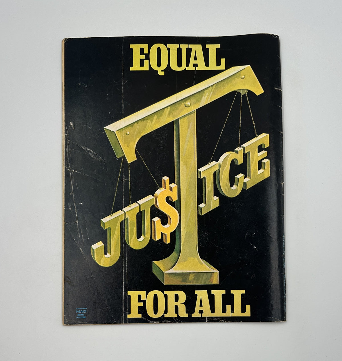 Cover of MAD Magazine No. 159 from June 1973 titled 'A Clockwork Lemon Obsolescence' featuring the artistic depiction of the phrase 'Equal Ju$Tice For All', highlighting the humorous and satirical nature of the publication.
