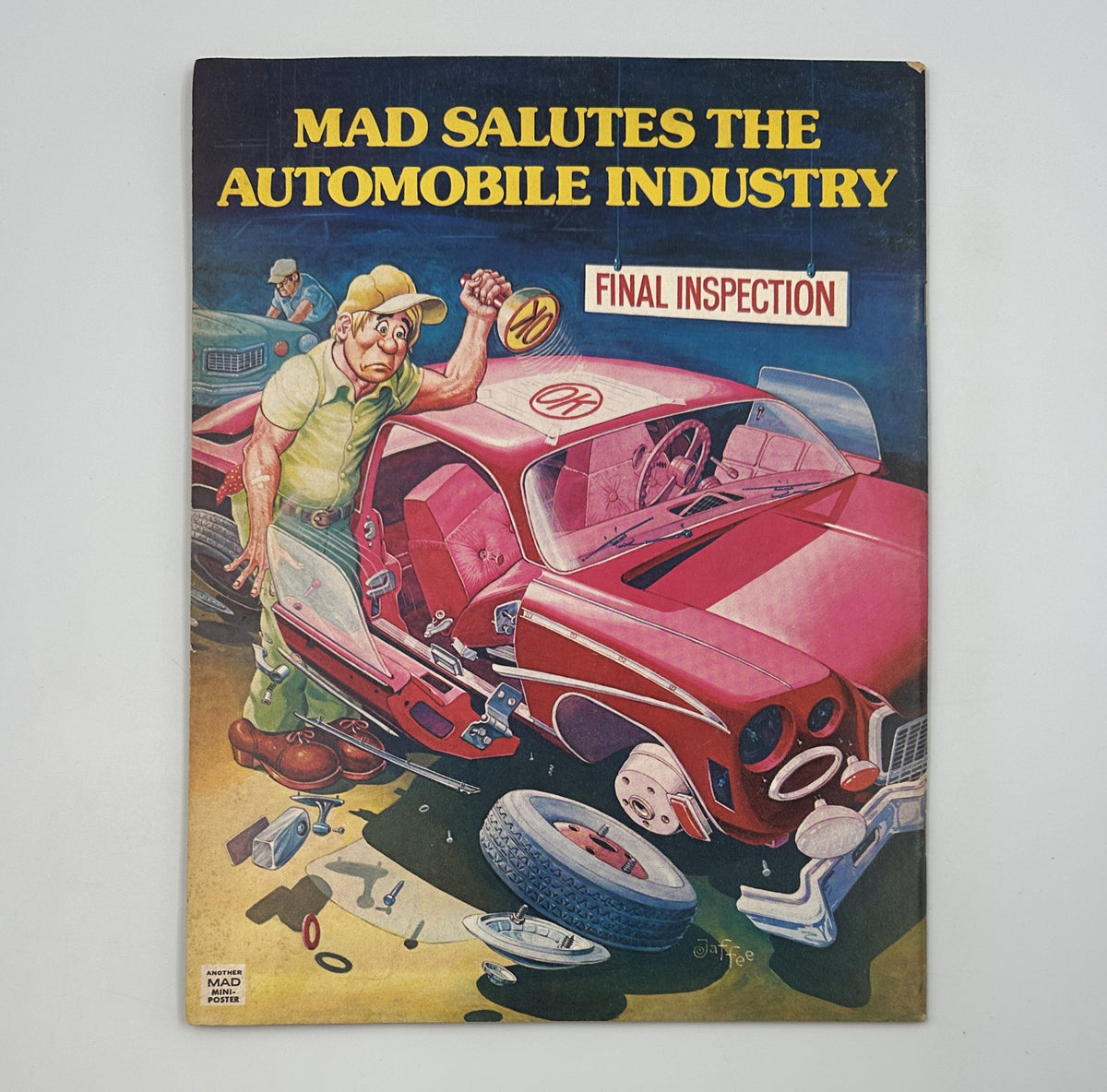 Back cover of MAD Magazine No. 190 from April 1977 featuring an illustration titled 'MAD Salutes the Automobile Industry' depicting a mechanic inspecting a disassembled car with tools scattered around.