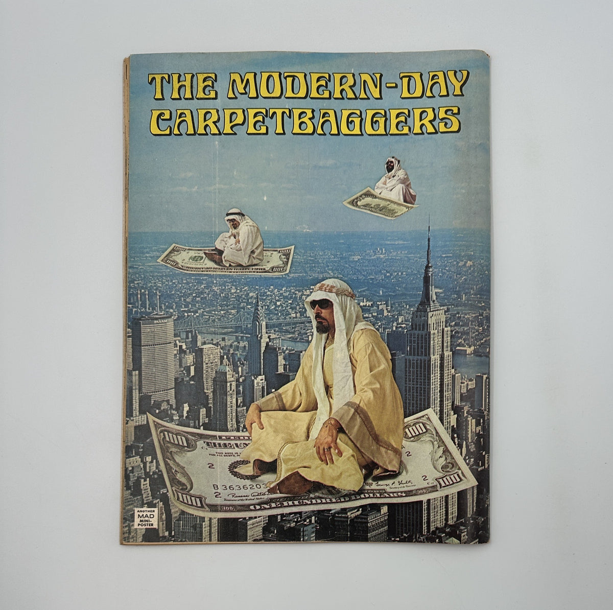 Cover of MAD Magazine No. 177, September 1975, titled 'The Modern-Day Carpetbaggers,' featuring a whimsical illustration of a man in traditional attire floating on a giant dollar bill above a city skyline.