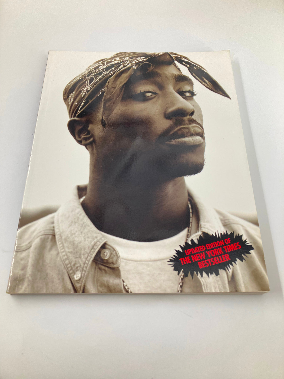 Cover of The New York Times Best Seller Memoir of Tupac Shakur 1971 - 1996 featuring a portrait of Tupac Shakur.