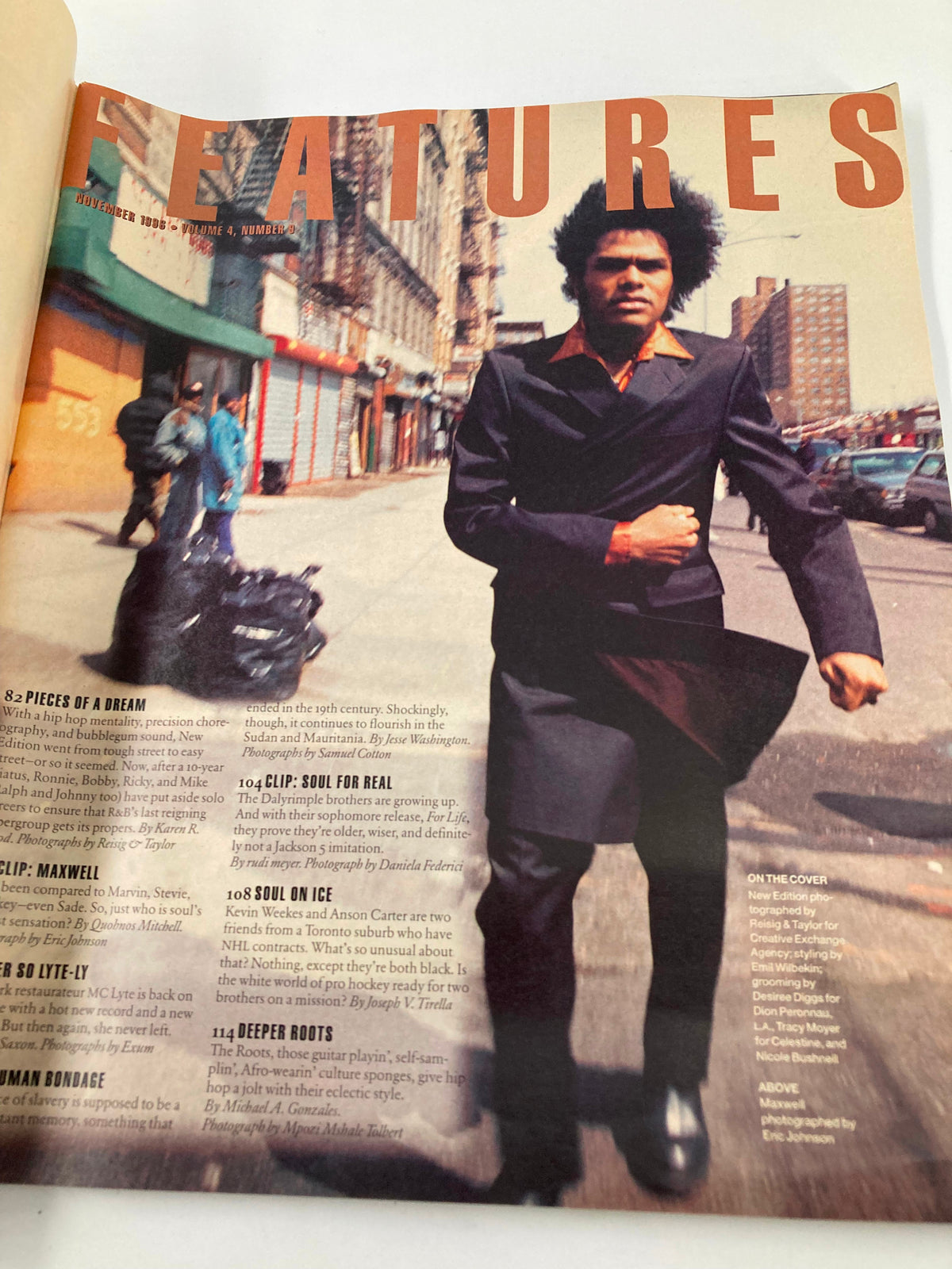 Feature page from Vibe Magazine November 1996, presenting a stylish individual in an urban setting, exemplifying the cultural themes of the magazine during the hip-hop era.