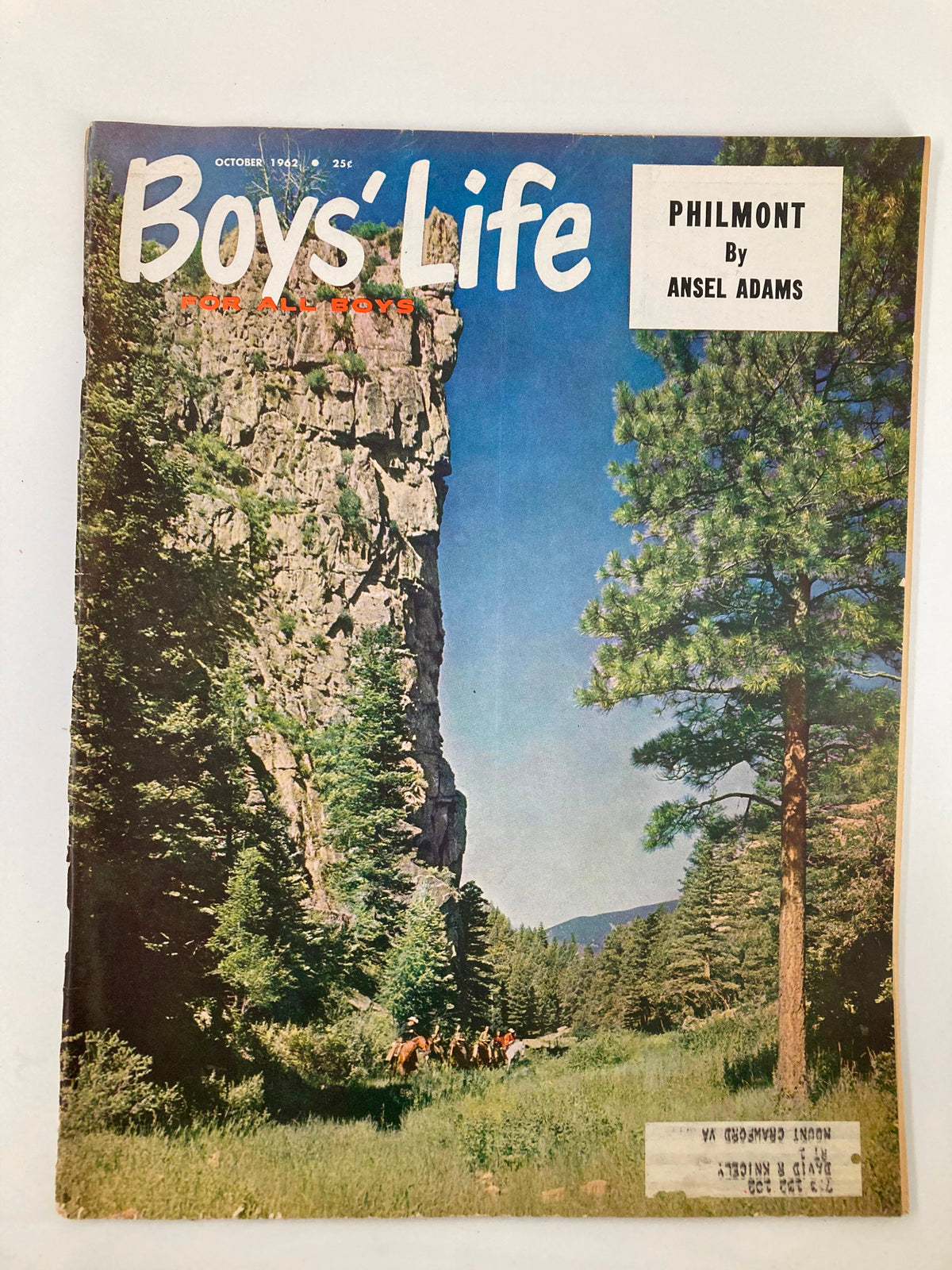Cover of VTG Boys' Life Magazine October 1962 featuring 'The Philmont' by Ansel Adams, showcasing a scenic landscape with tall cliffs and greenery, highlighting the essence of outdoor adventure.
