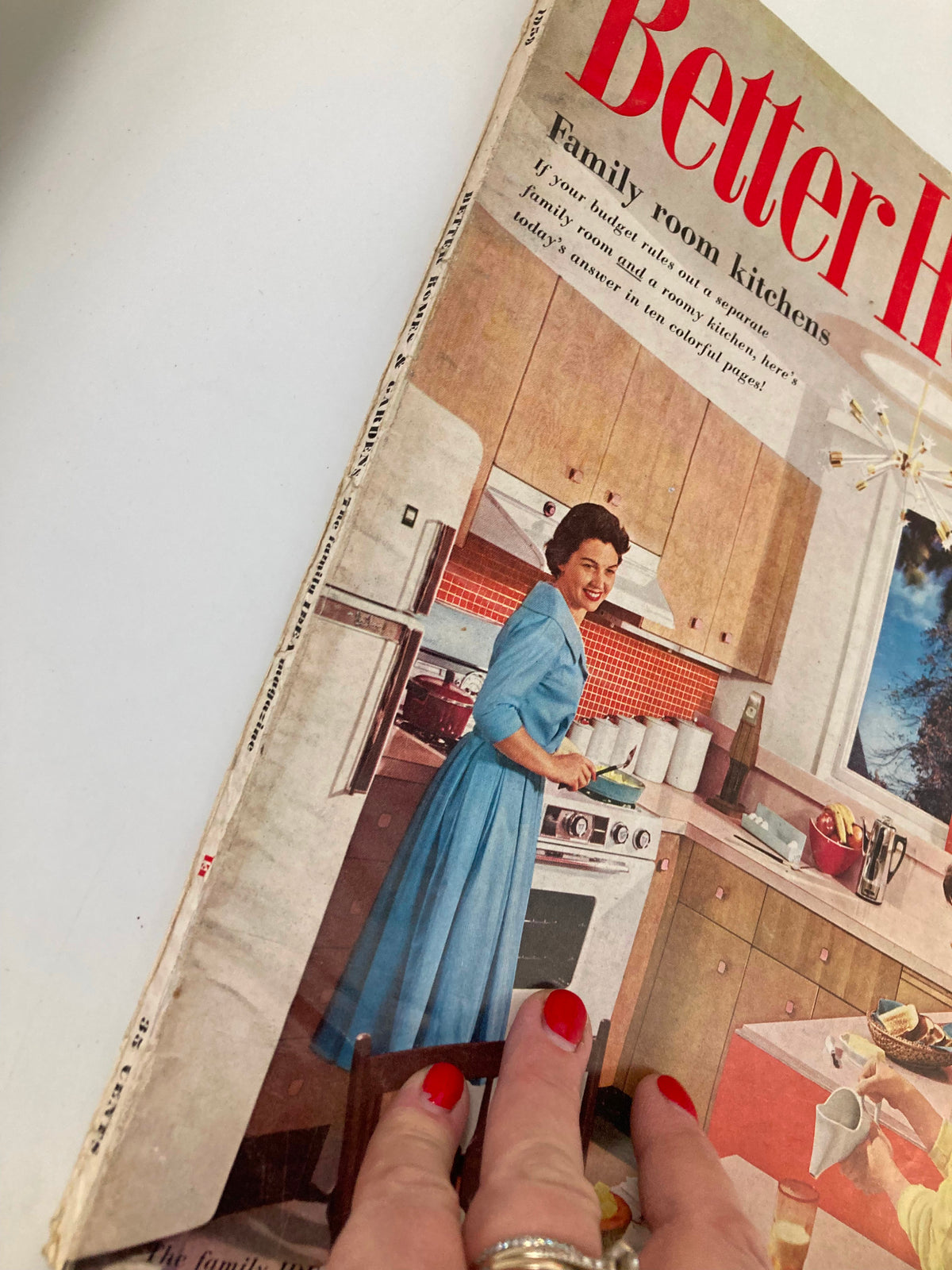 Close-up of the cover of VTG Better Homes & Gardens Magazine October 1959 featuring a woman cooking in the kitchen.